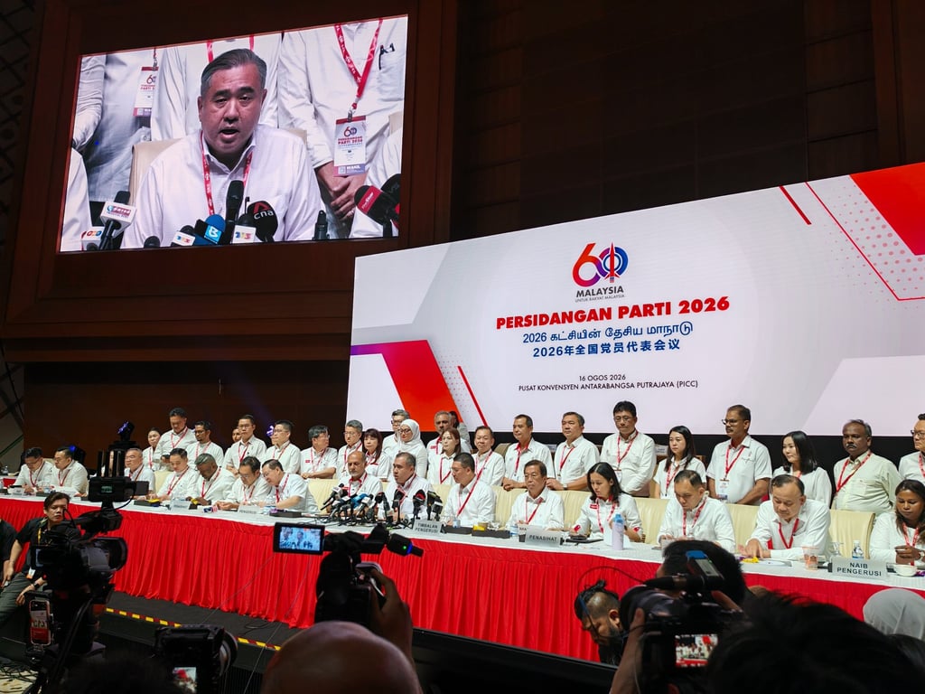 DAP Secretary General Anthony Loke is projected onto the big screen as he chairs a press conference on Sunday. Photo: Joseph Sipalan