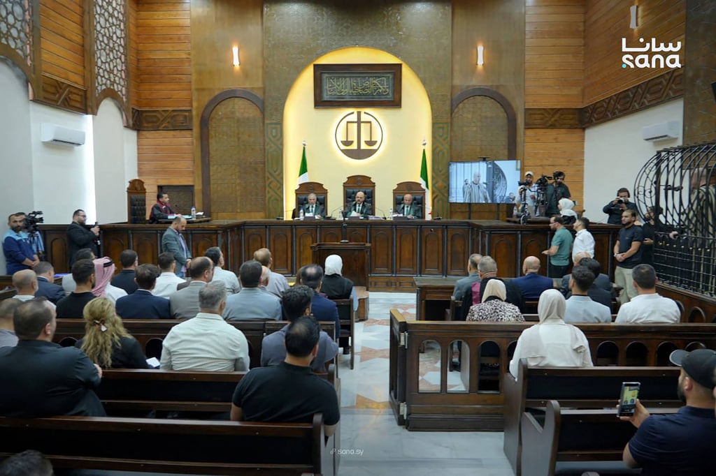 Judge Fakhr al-Din al-Aryan (centre) during the sentencing of Wassim al-Assad (right) at the Fourth Criminal Court in Damascus on Tuesday. Photo: Syrian Arab News Agency / AFP
