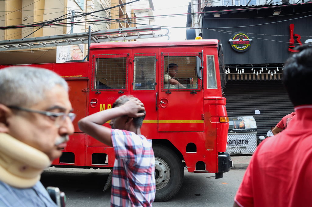 A fire truck stands by near a hotel where a fire broke out and killed several people in Kolkata on Wednesday. Photo: Reuters