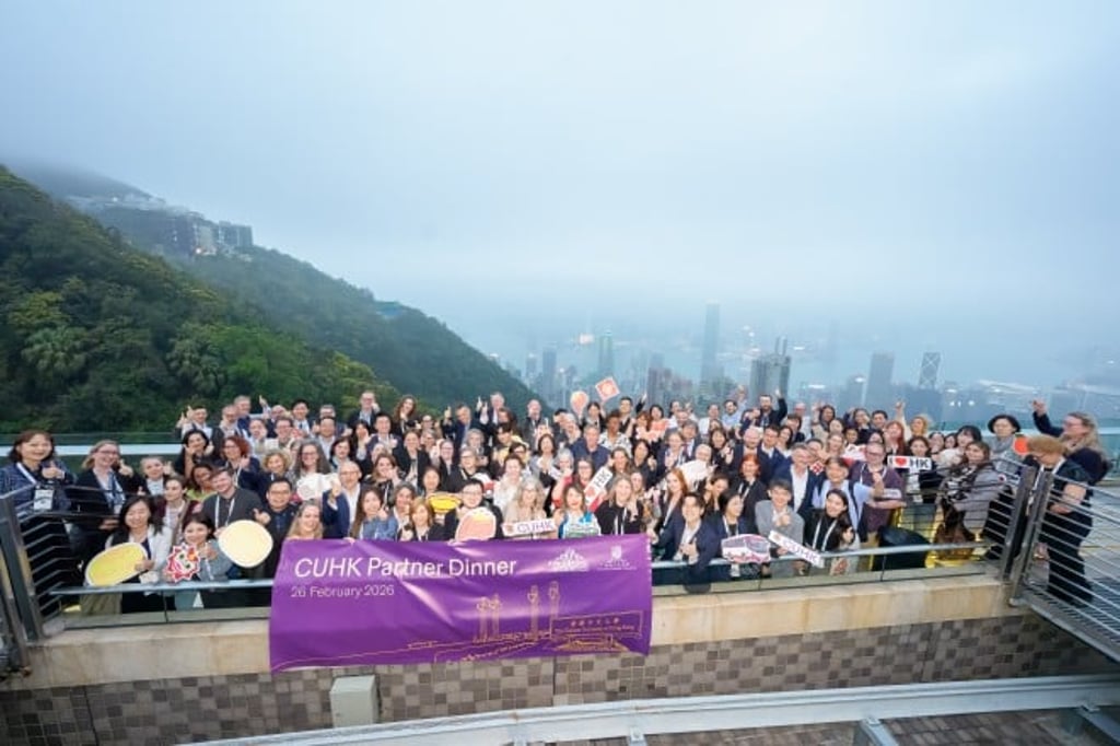 A happy moment for all: CUHK partners posed for a group photo at the Sky Terrace 428.