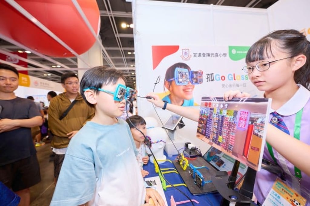 The Christian Alliance H.C. Chan Primary School team with their AI-powered smart glasses designed to help visually impaired people recognise locations and bus numbers.