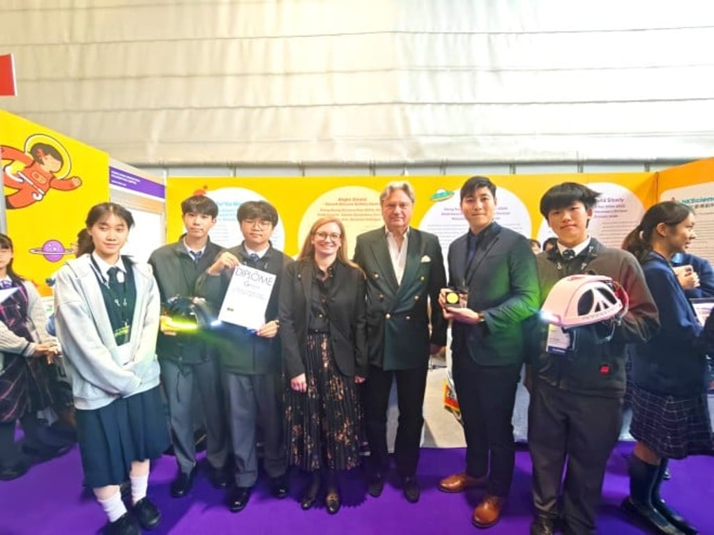 Students from SPHRC Kung Yik She Secondary School showcase a smart cycling helmet designed to enhance road safety through automated warning signals, blind-spot detection and accident alerts.