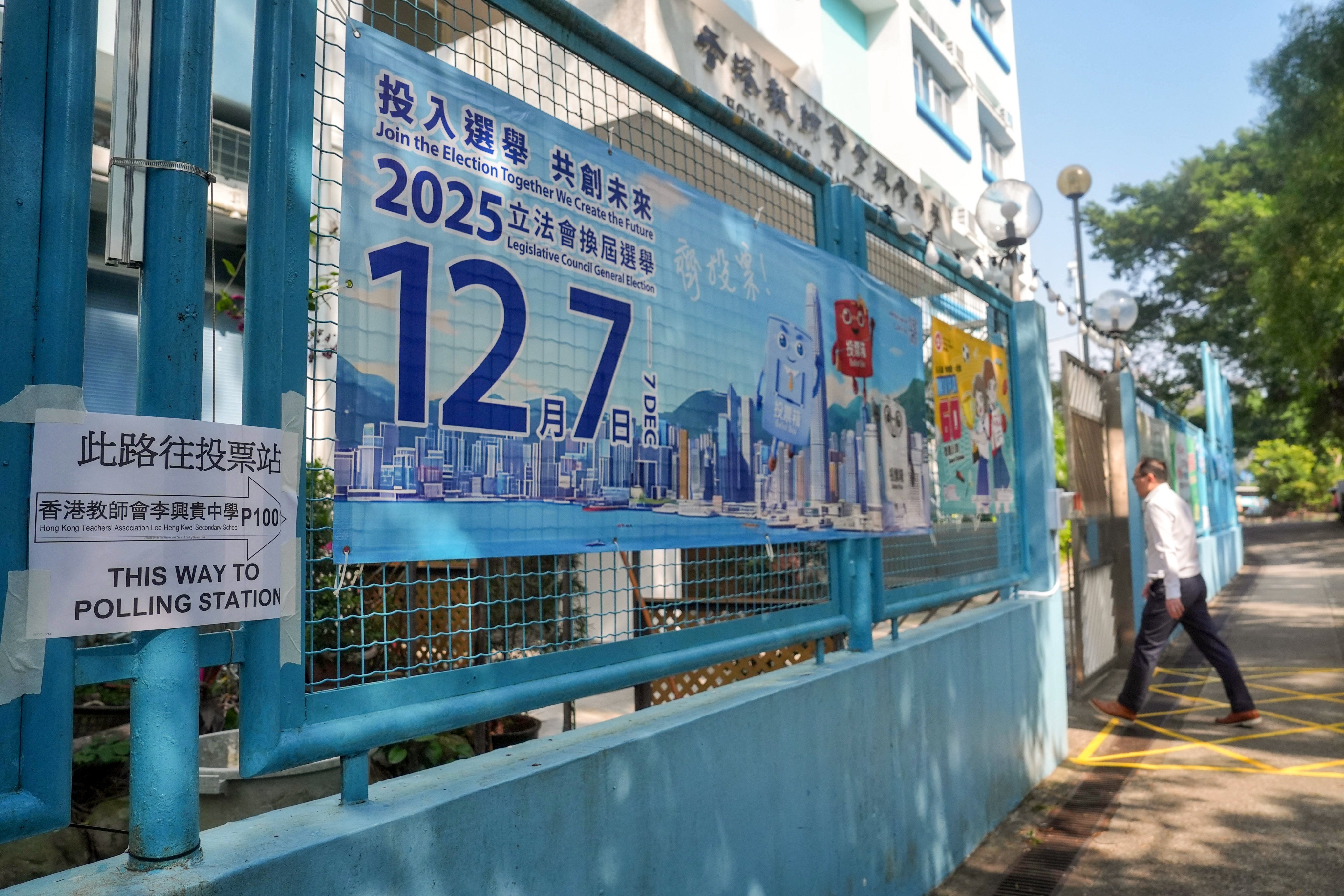 A resident enters a polling station at Hong Kong Teachers’ Association Lee Heng Kwei Secondary School in Tai Po during last year’s Legislative Council election. Photo: Elson Li