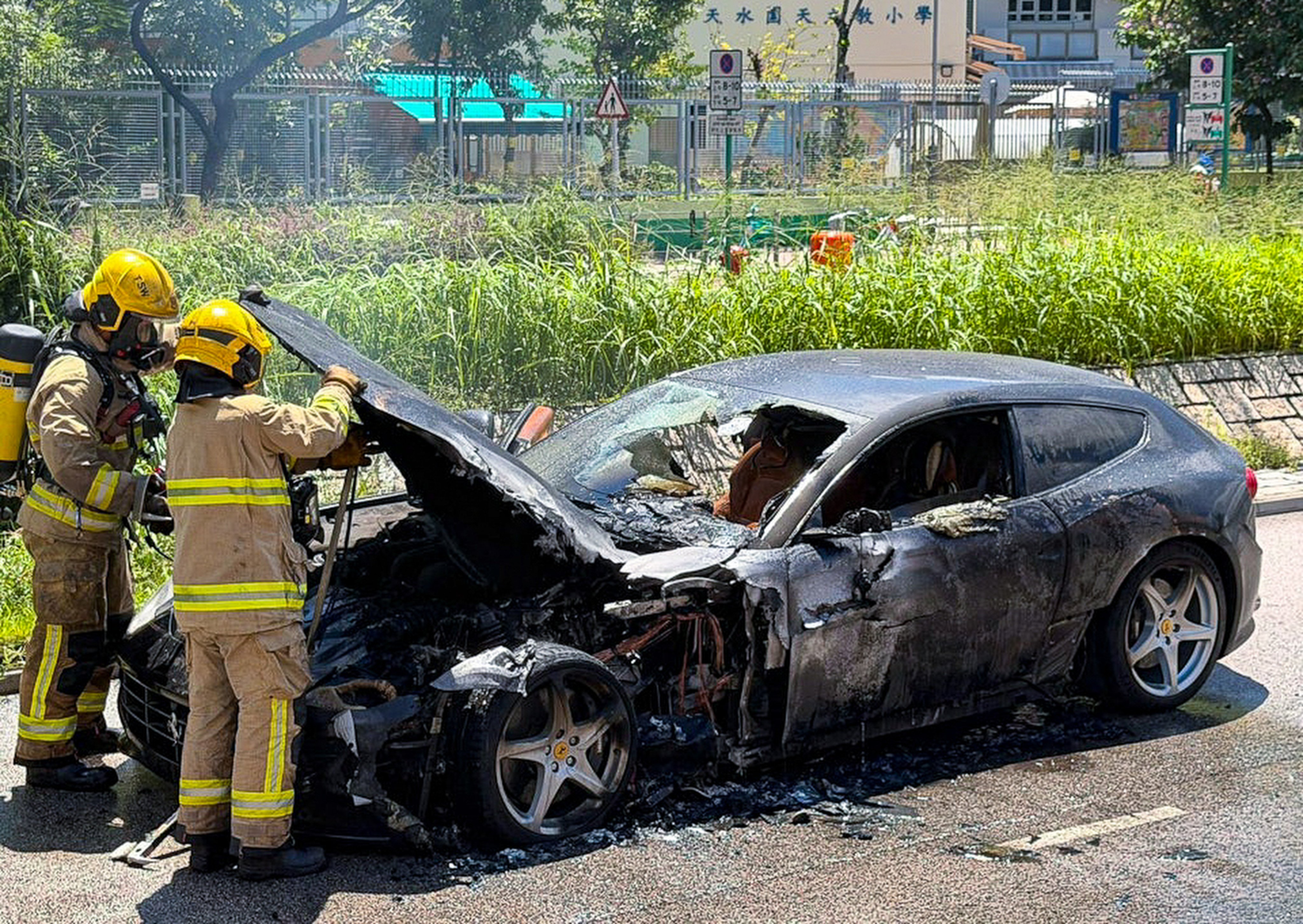A black Ferrari caught fire near a light rail stop. Photo: Handout