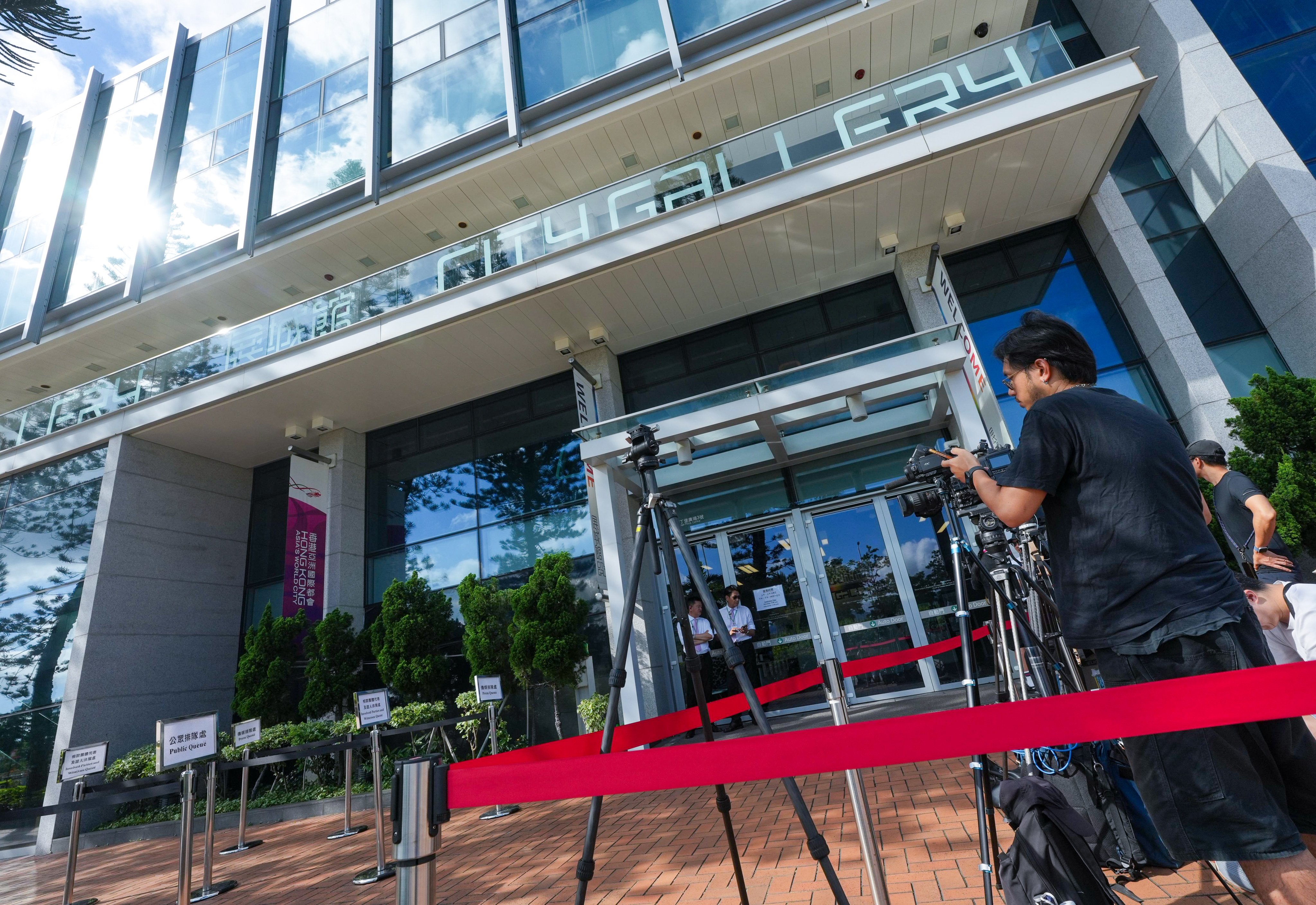 Journalists wait outside City Gallery in Central where the hearing is held. Photo: Sun Yeung