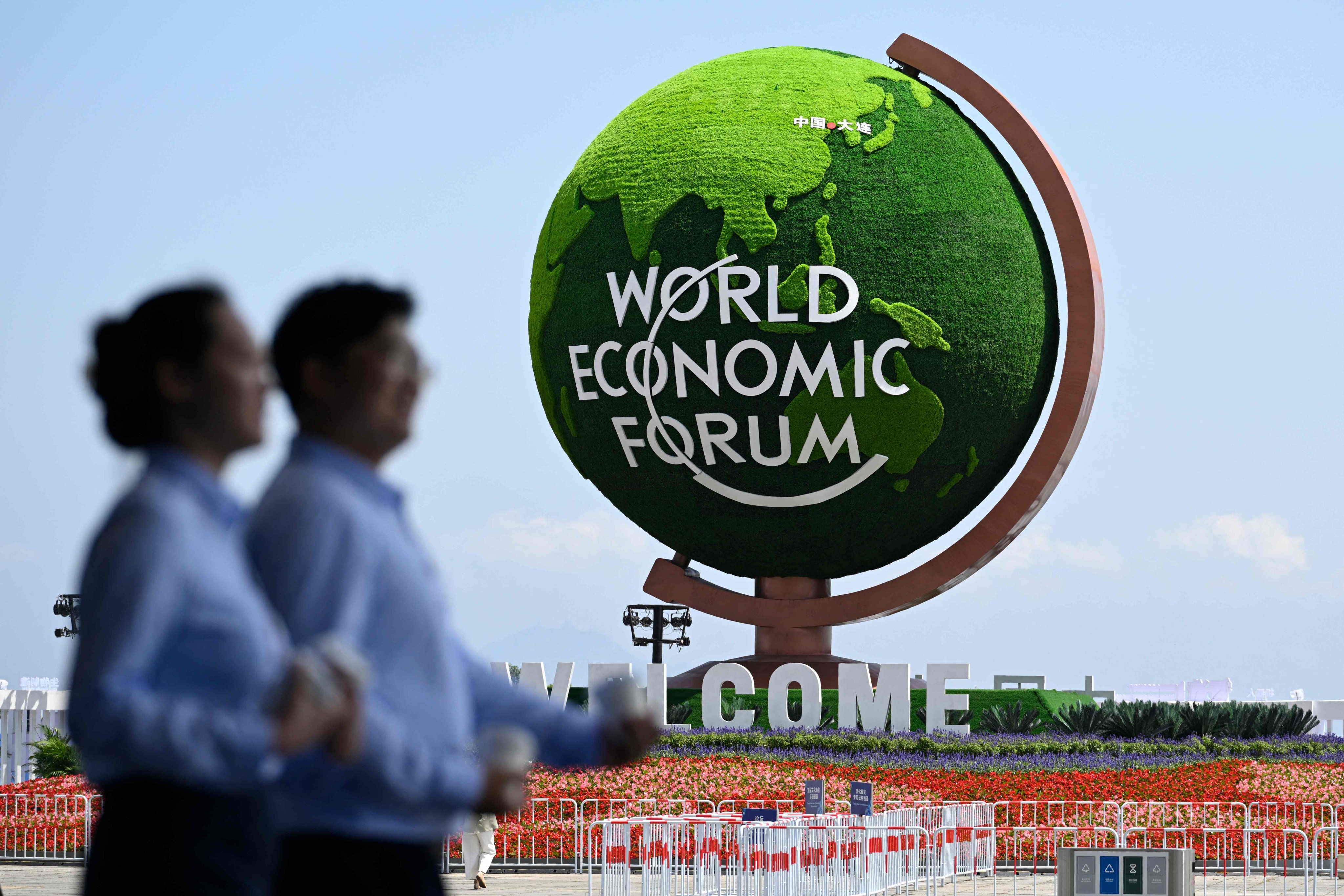 The logo of the World Economic Forum is pictured outside the Dalian International Conference Centre during the World Economic Forum Annual Meeting of the New Champions in Dalian, China’s Liaoning province, on June 23. Photo: AFP