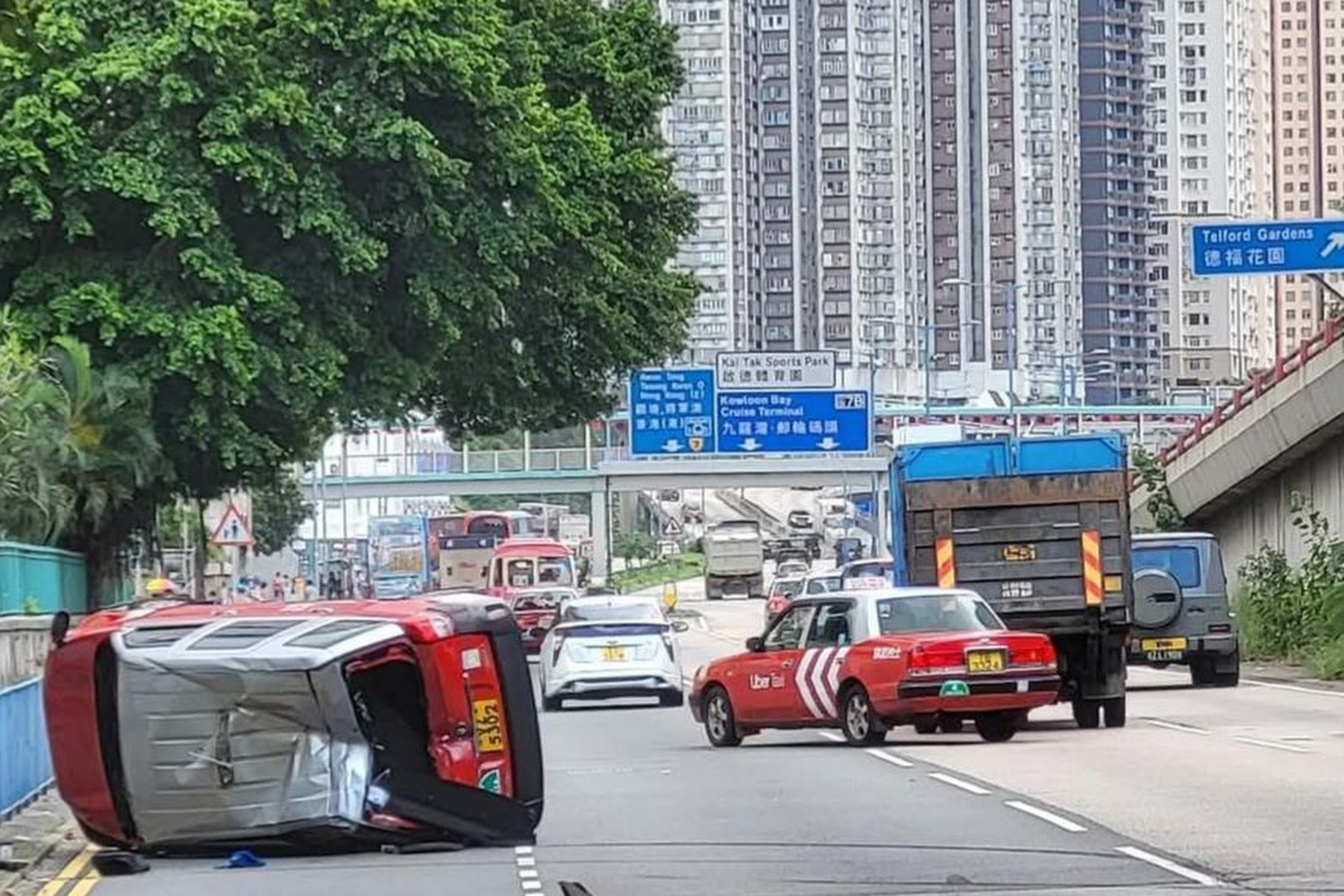 A taxi driver and a passenger were injured after the vehicle collided with a medium goods vehicle on Kwun Tong Road on Tuesday afternoon. Photo: Handout
