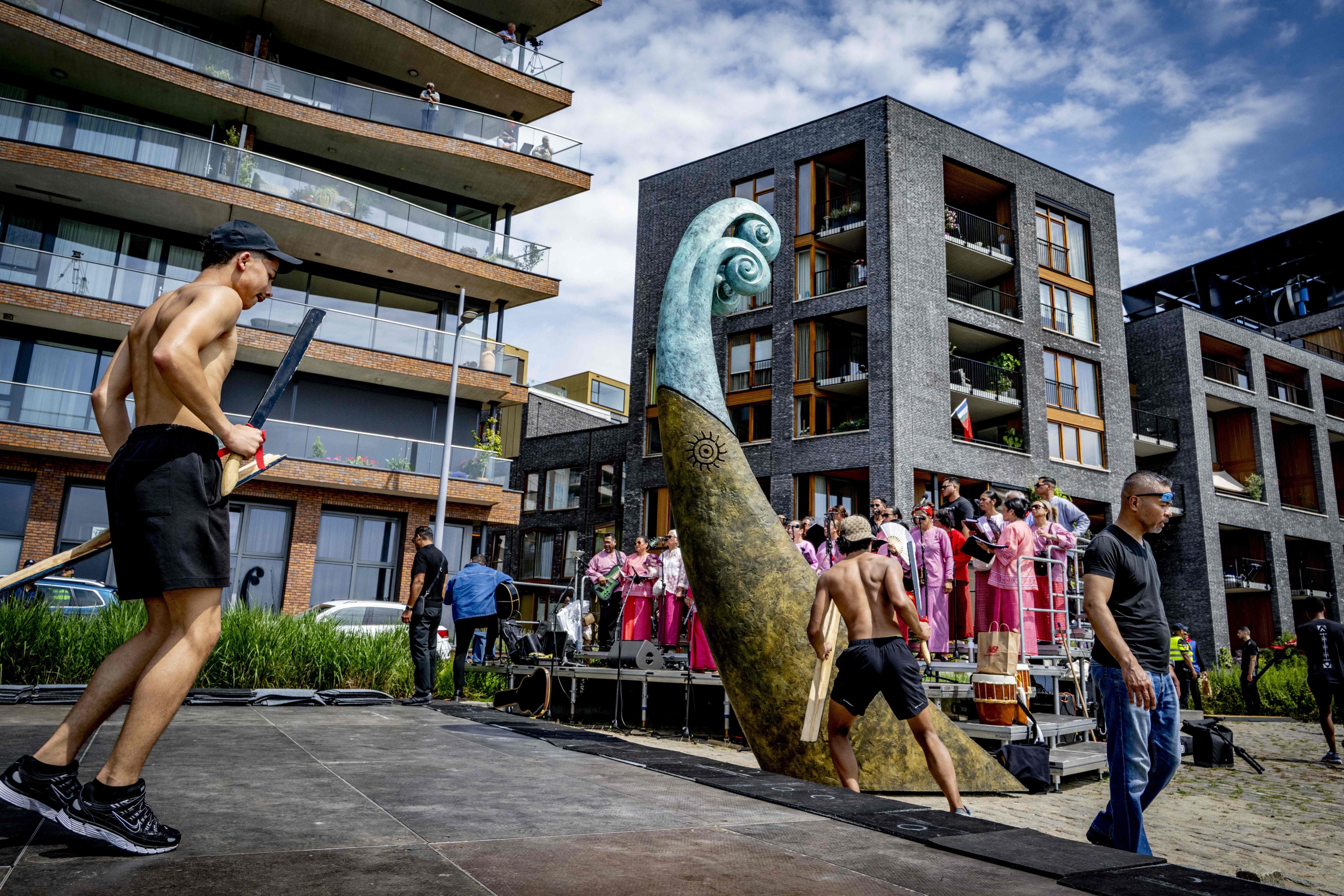Artists perform ahead of the unveiling of a national monument at the Lloydkade for Moluccans during the commemoration of the Moluccan community that arrived there 75 years ago, in Rotterdam on June 21. Photo: AFP