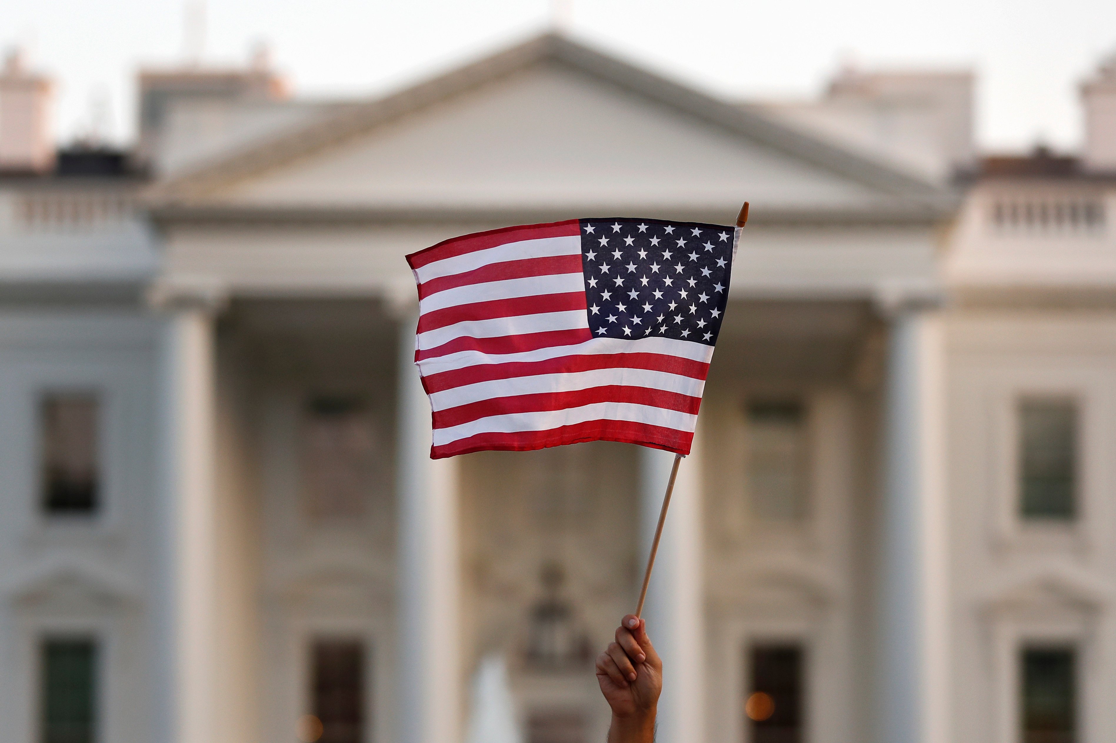A US flag waves outside the White House in Washington. File photo: AP
