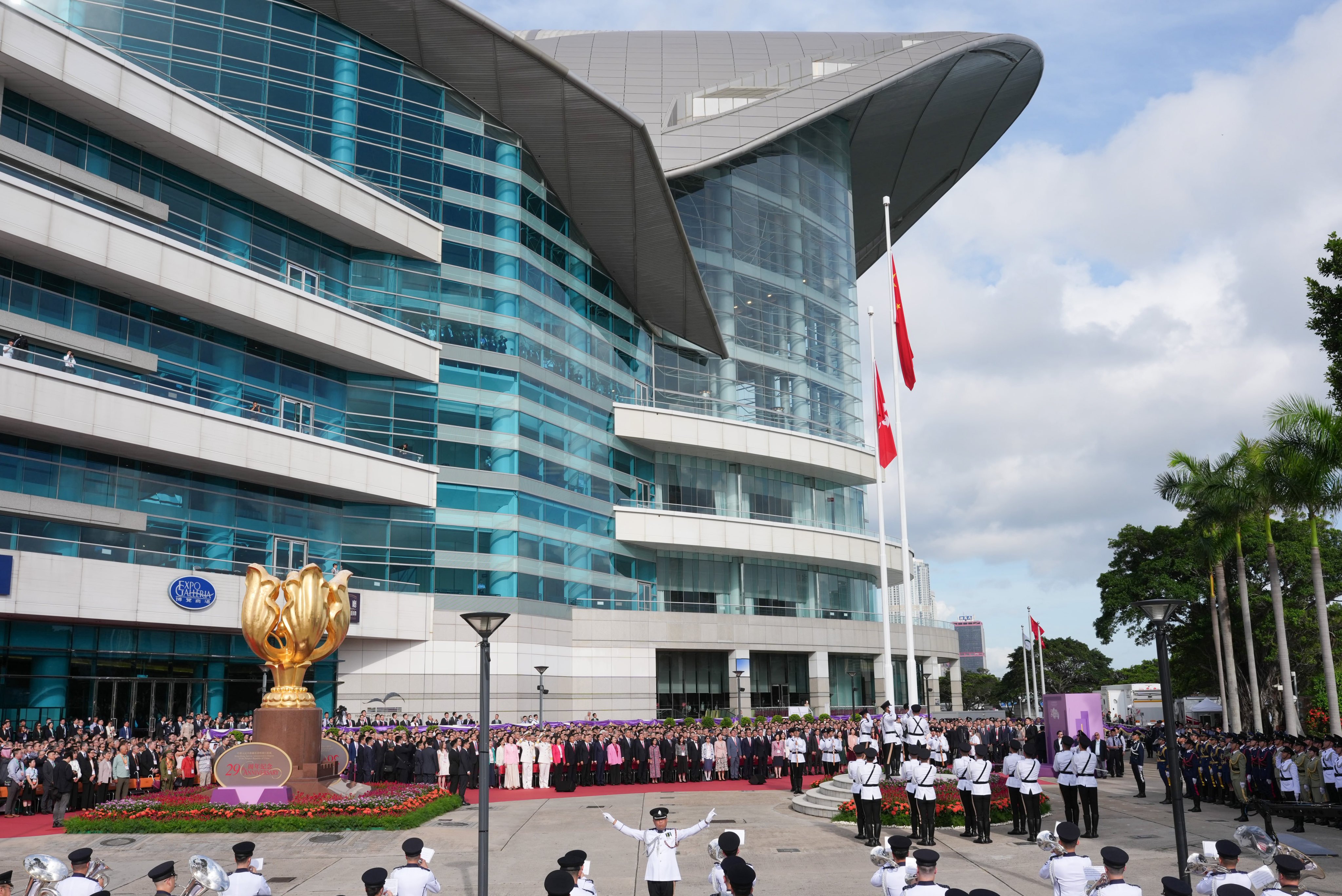 Handover celebrations kick off with a flag-raising ceremony. Photo: Karma Lo
