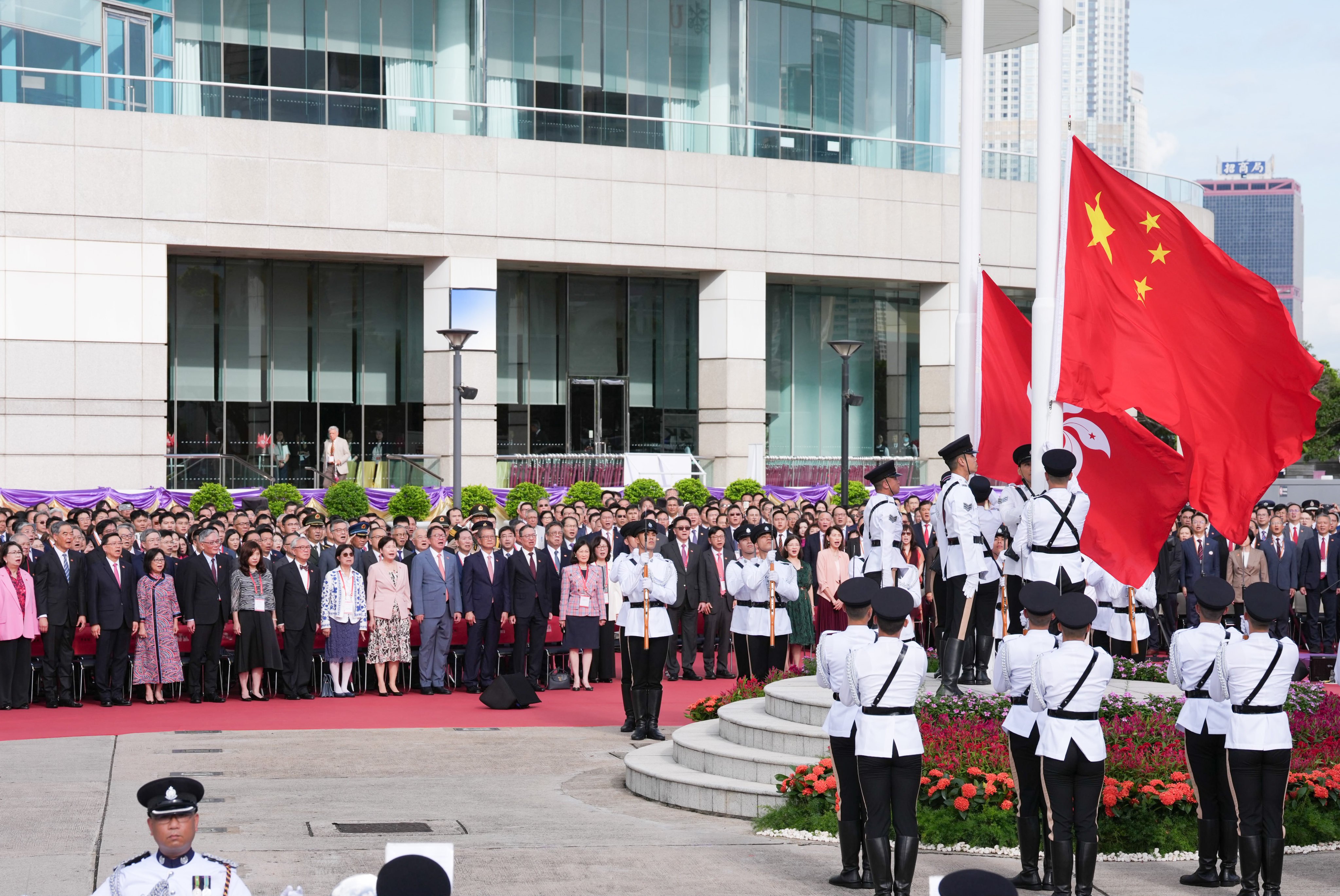 Officials attend the flag-raising ceremony. Photo: Karma Lo
