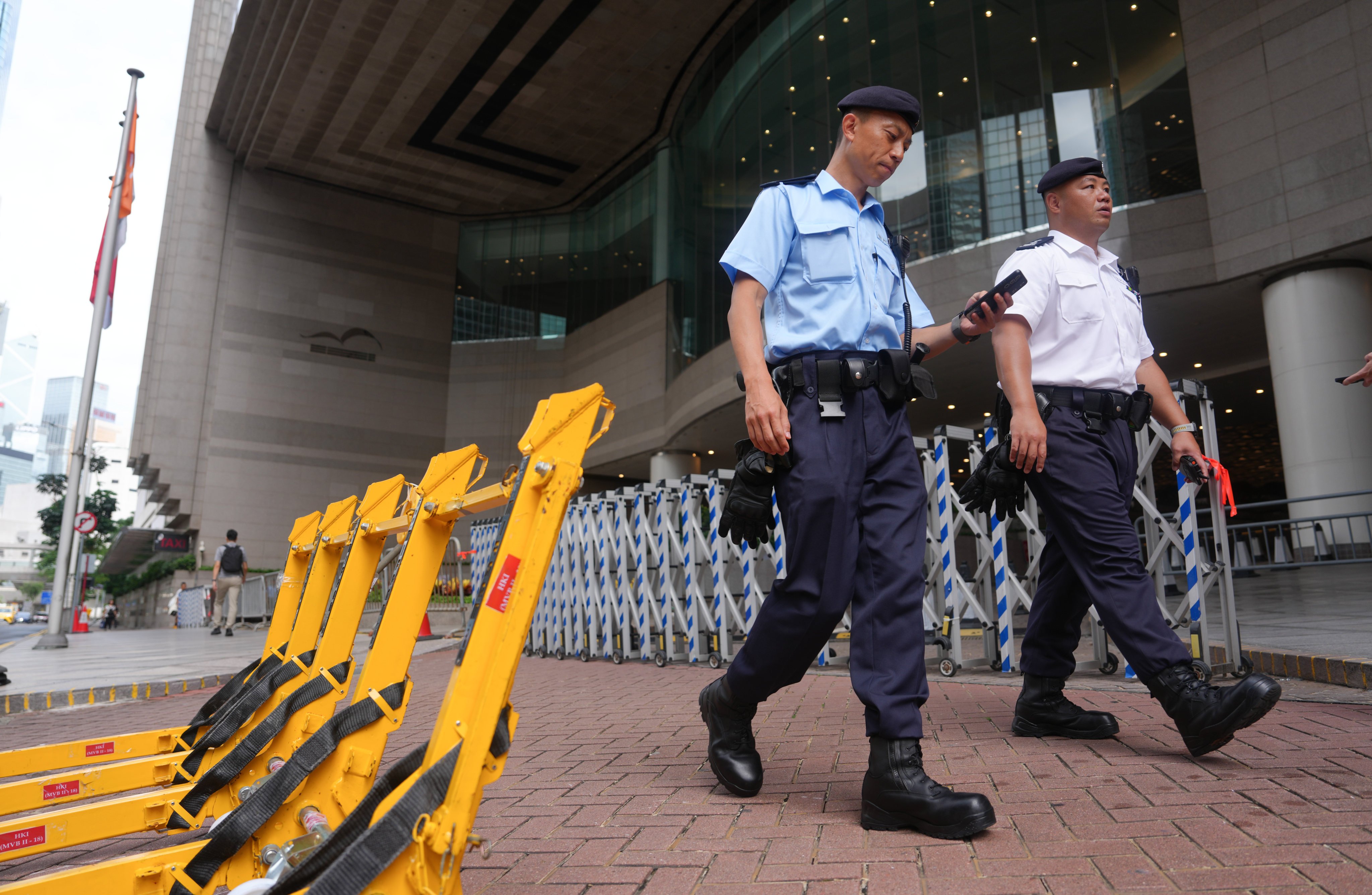 Police officers patrol the area around the Hong Kong Convention and Exhibition Centre in Wan Chai. Photo: Sam Tsang