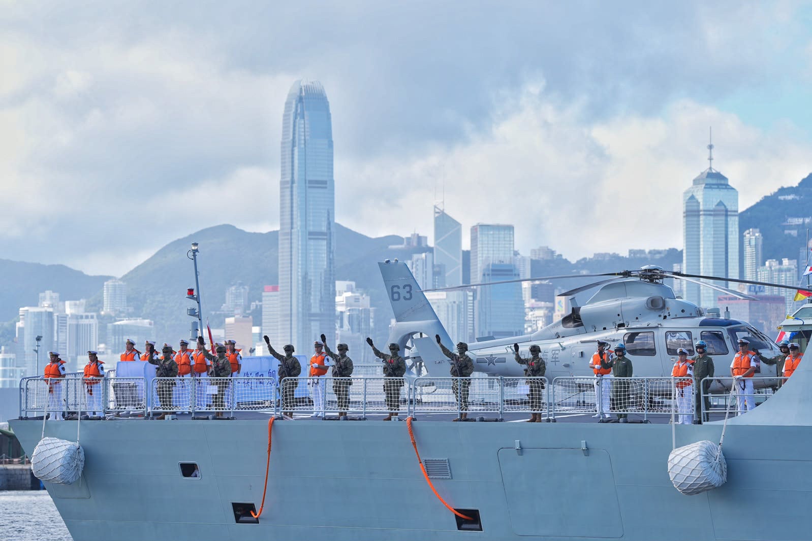 PLA crew members wave from the frigate Hengyang. Photo: Elson Li