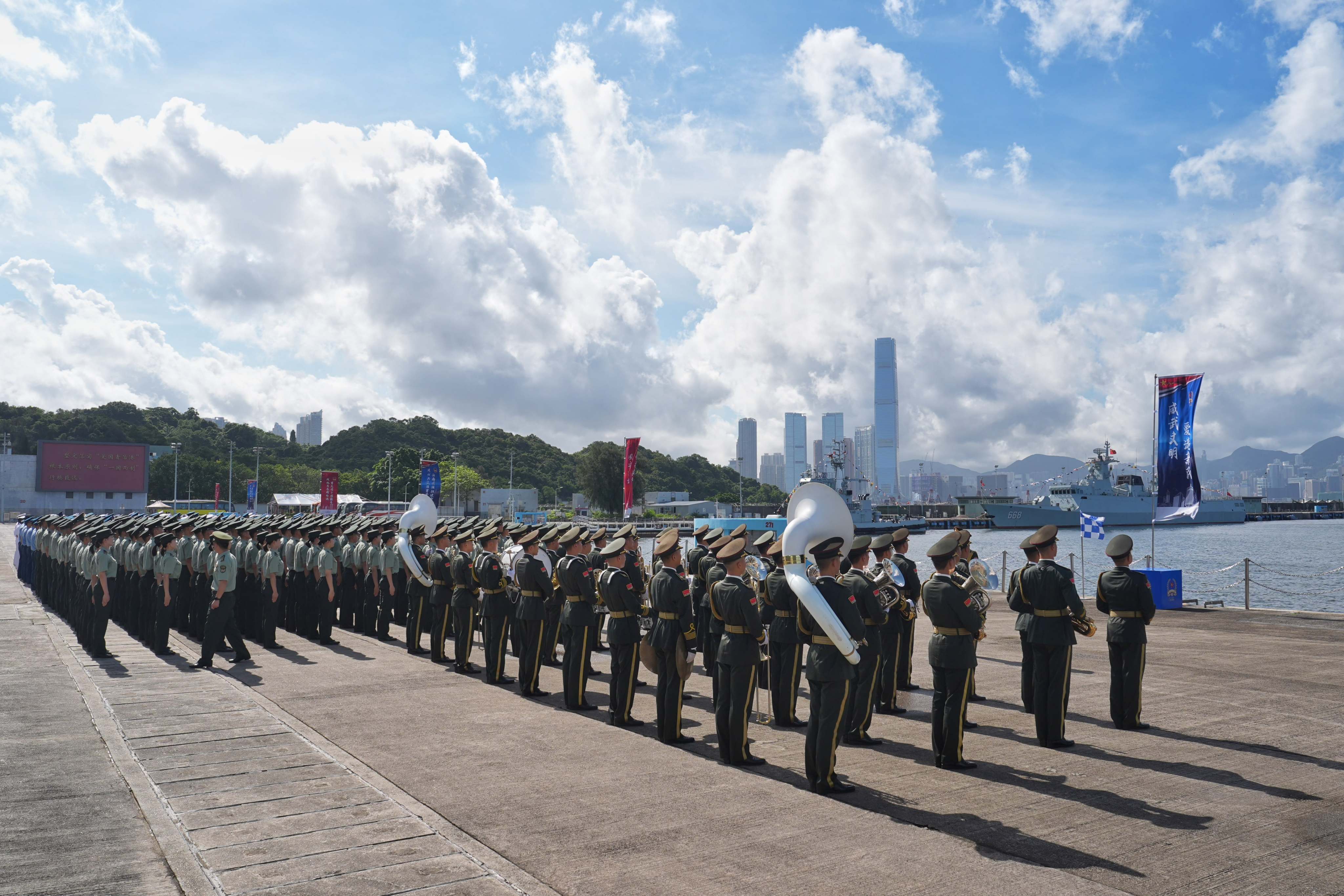 A band strikes up on Stonecutters Island to welcome the vessels as they arrive. Photo: Elson Li