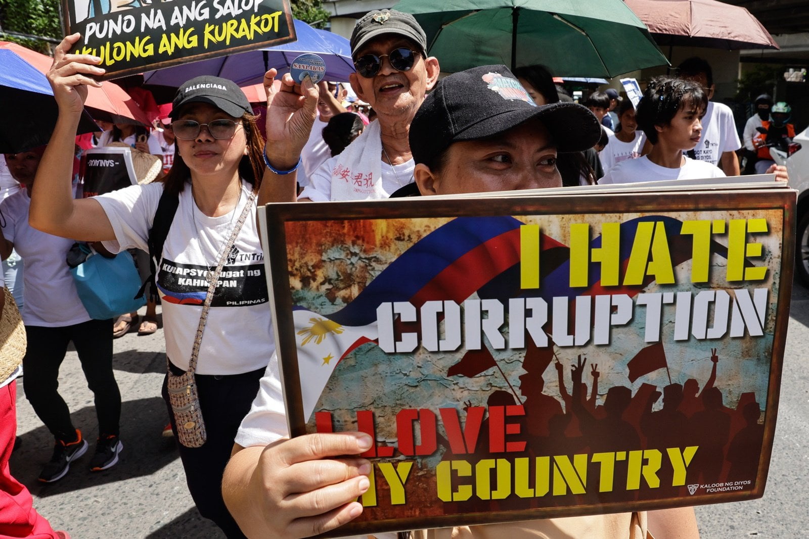 A protester holds a sign during an anti-corruption rally in Quezon City, Metro Manila, the Philippines, on June 28. Photo: EPA