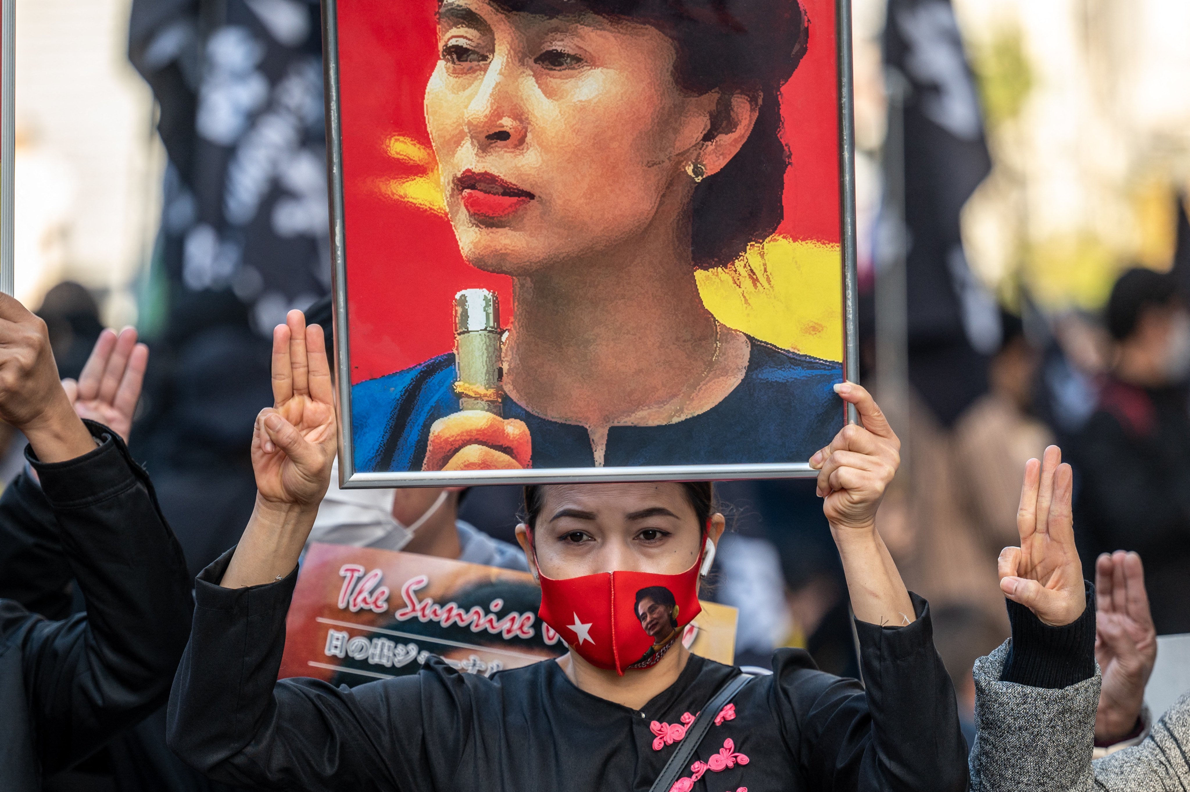 An activist holds an image of Myanmar’s ousted civilian leader Aung San Suu Kyi at an anti-coup rally in Tokyo in December 2021. Photo: AFP