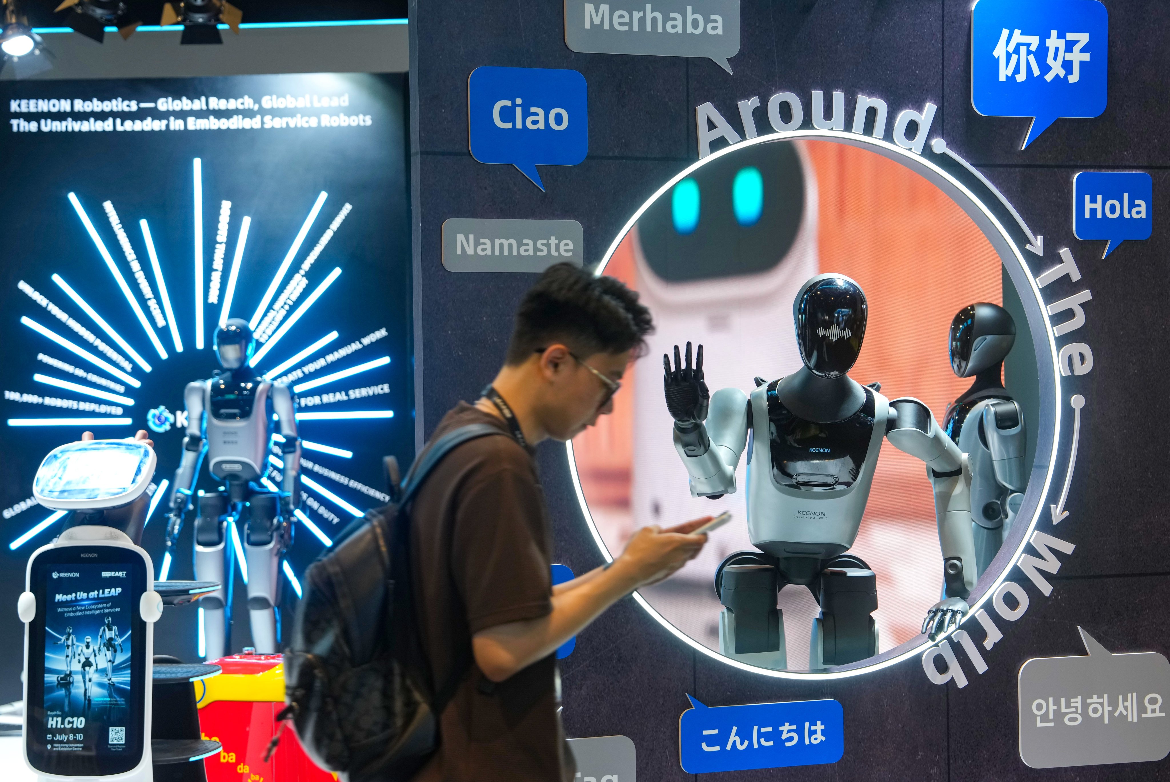 An attendee walks past an exhibit at LEAP East 2026. Photo: Sam Tsang