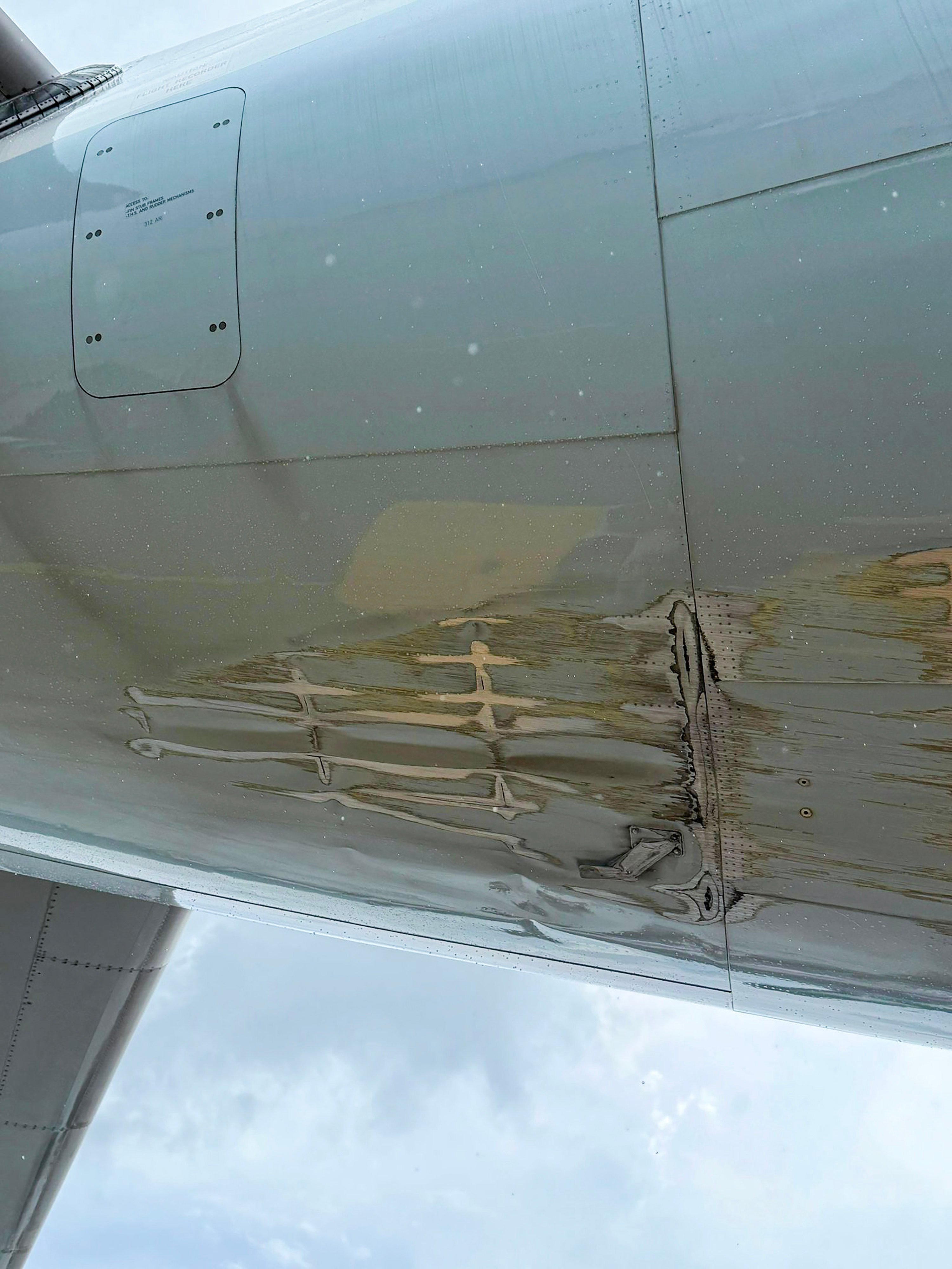 Extensive scraping can be seen along the underside of the aircraft’s rear fuselage. Photo: Handout