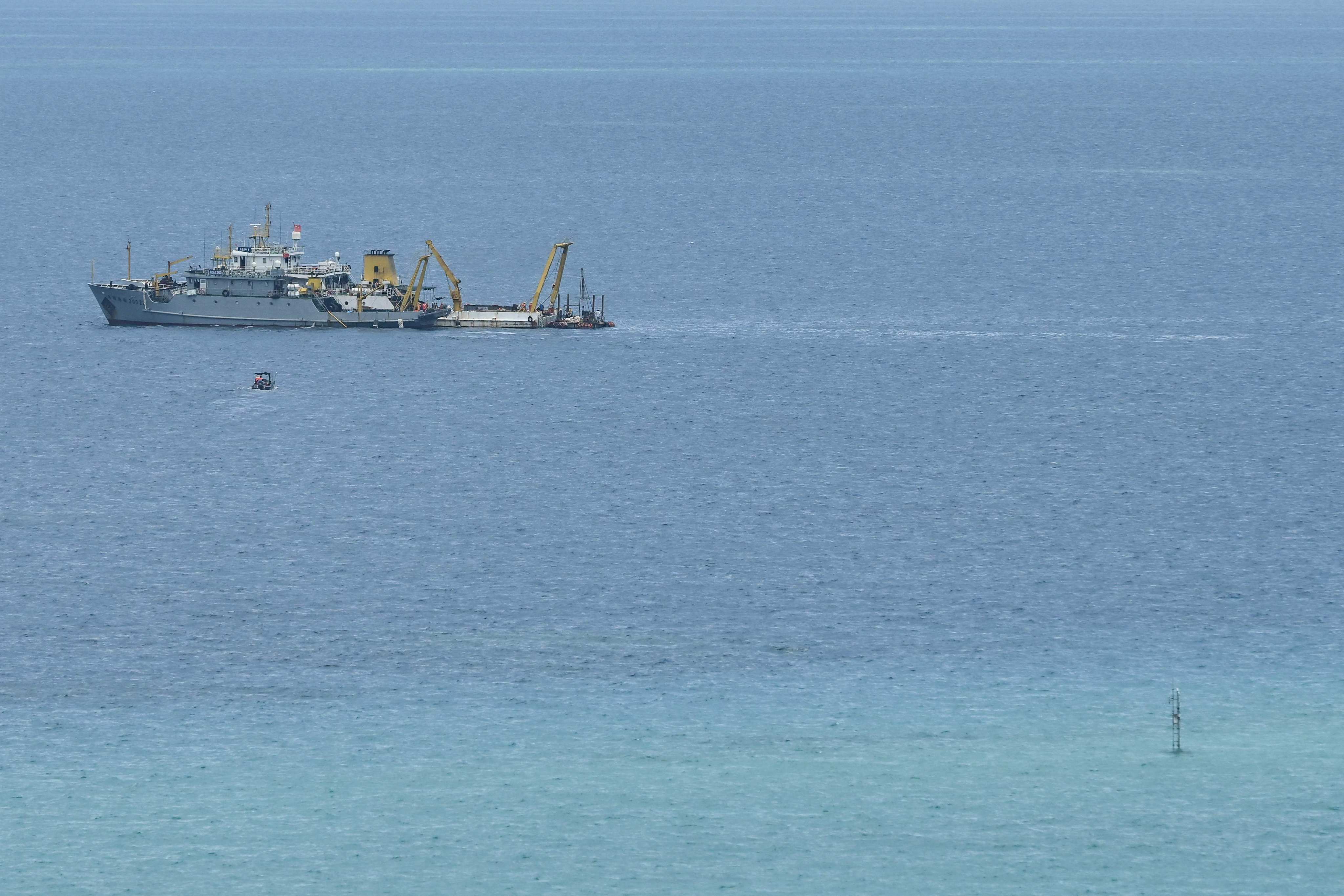 Ships identified by the Philippine Coast Guard as Chinese research vessels are seen at Scarborough Shoal in the disputed South China Sea on June 15. Photo: AFP