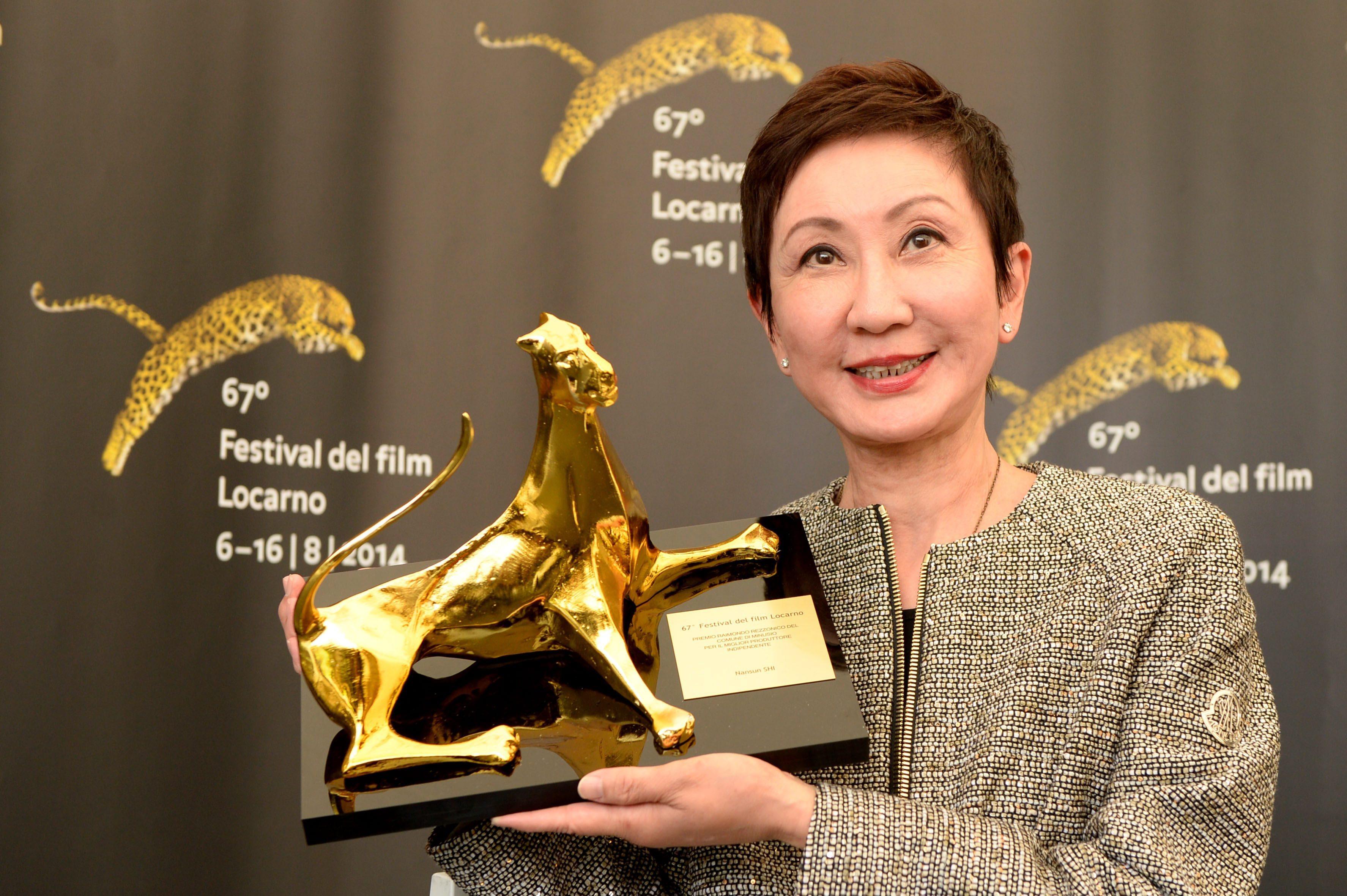 Shi Nan-sun with her award for best independent producer at the 67th Locarno International Film Festival in 2014. Photo: EPA