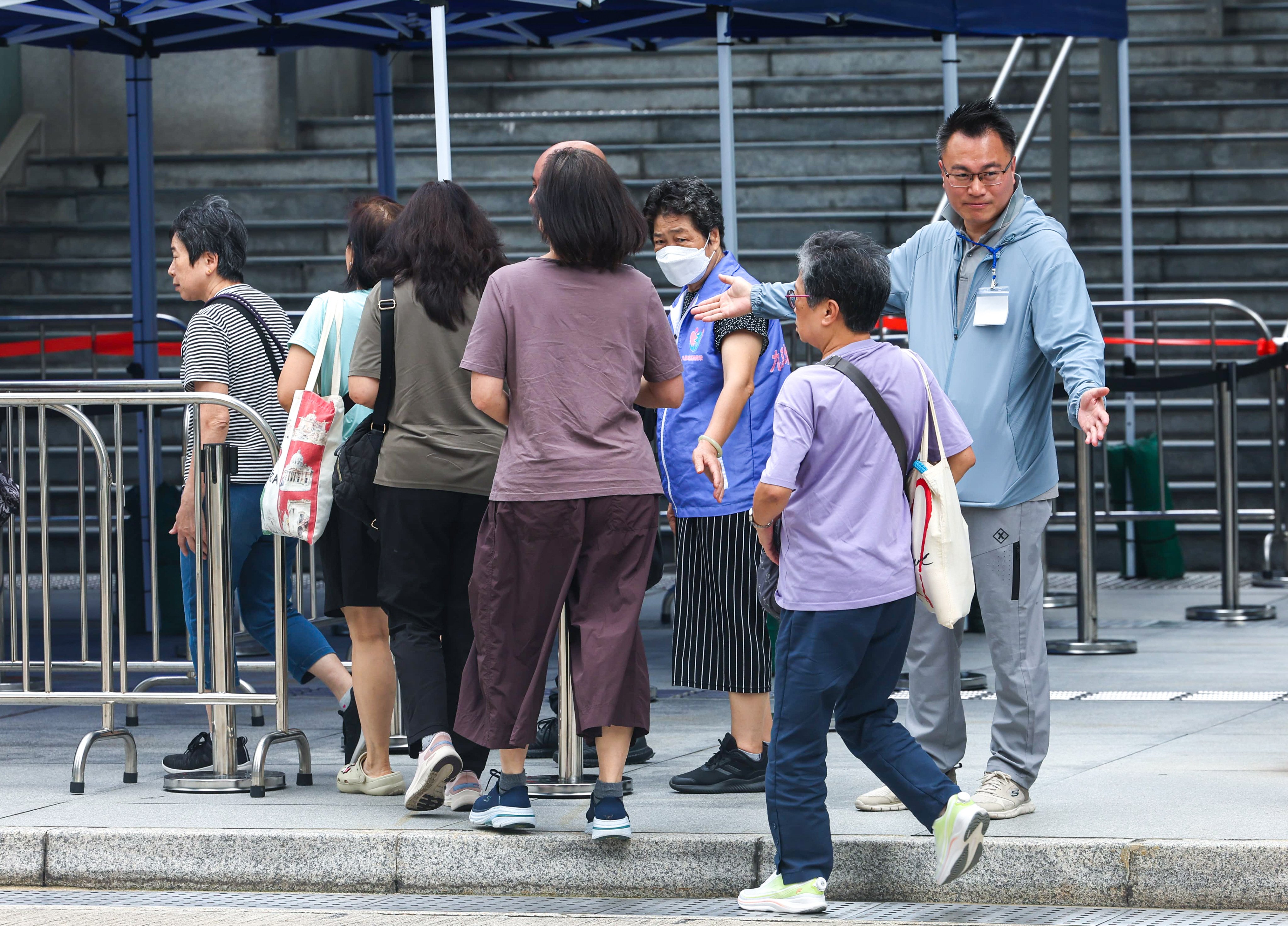 Home owners arrive for the meeting at the Kai Tak Community Hall. Photo: Edmond So
