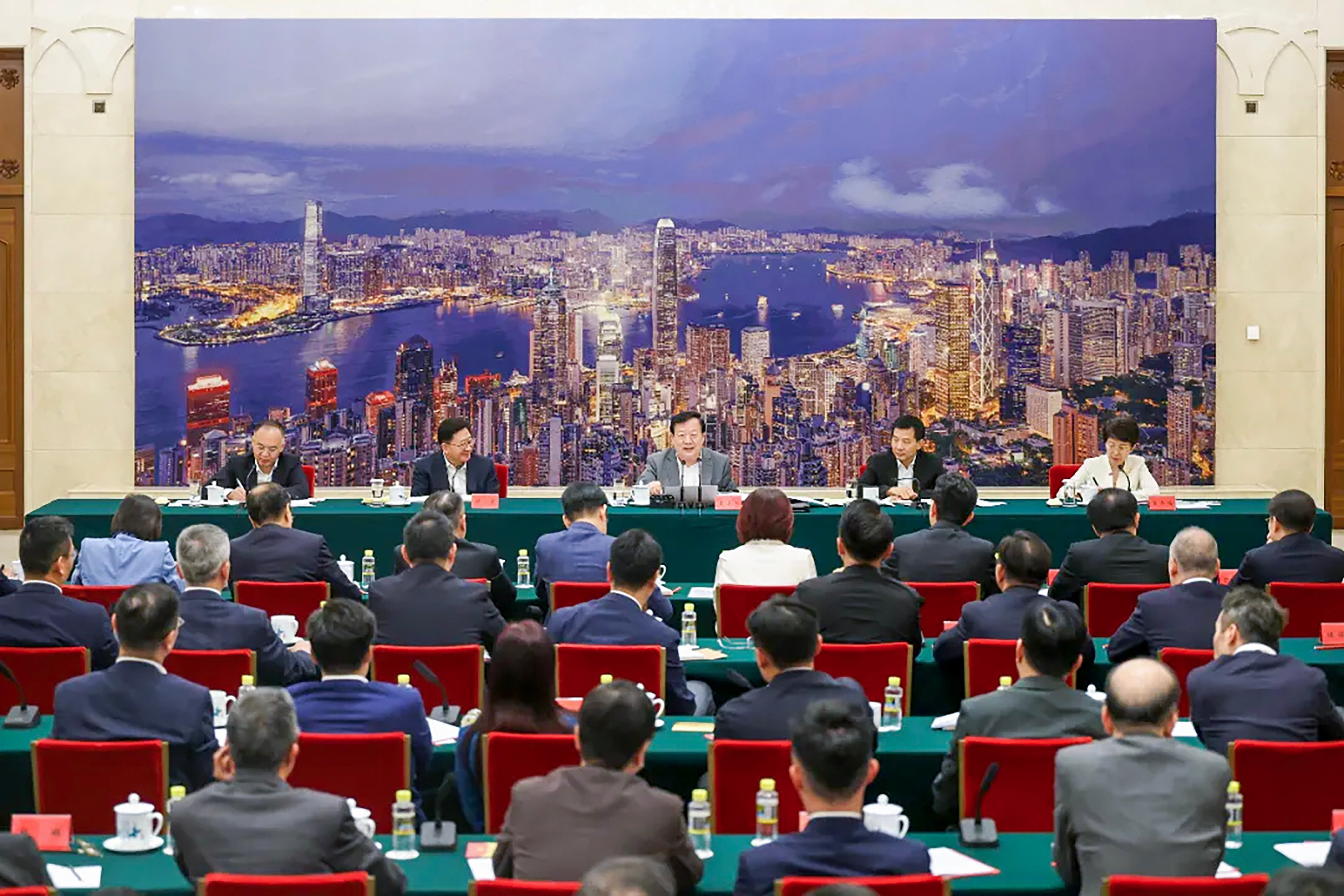 Xia Baolong (centre), flanked by other officials, meets the lawmakers in Beijing. Photo: Handout