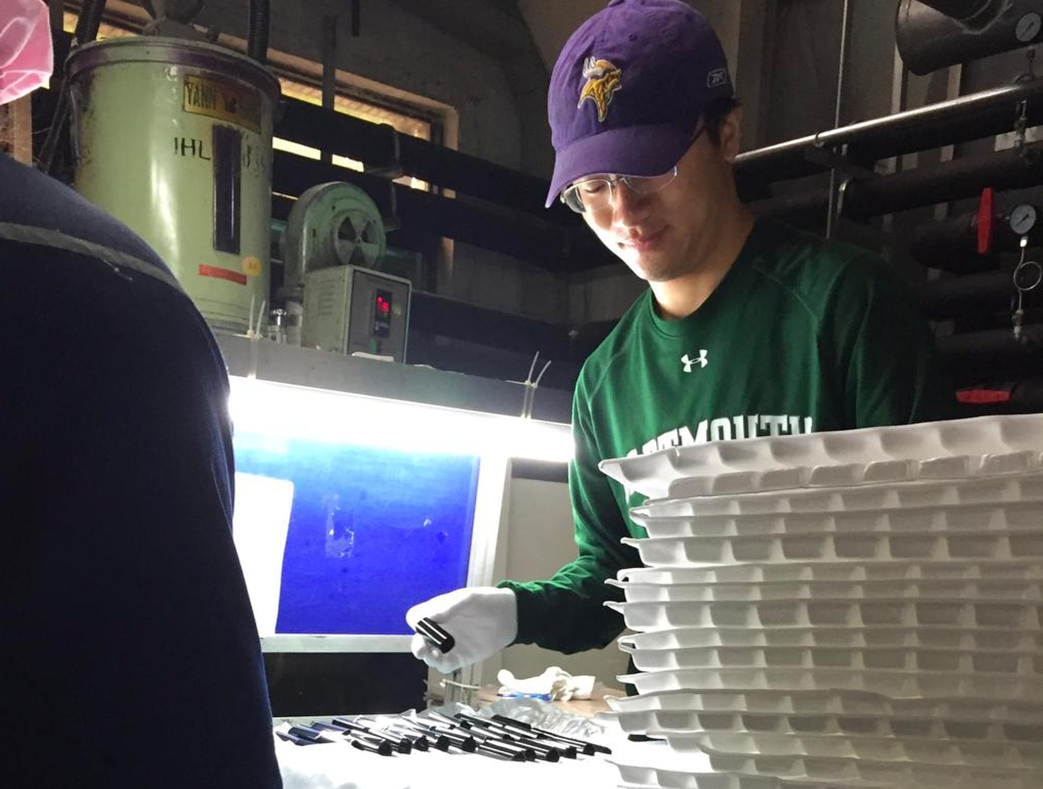 Zhou gets a closer look at a factory’s production workflow to understand potential improvements. Photo: Handout