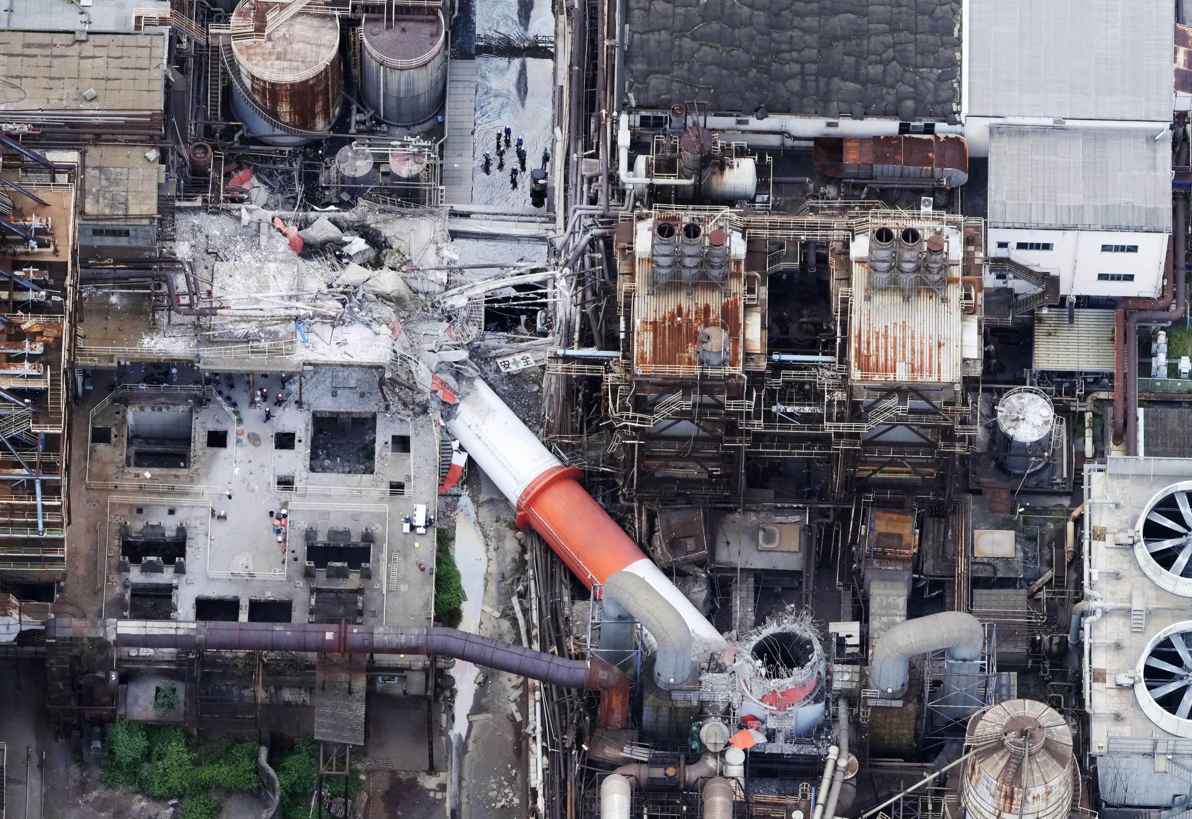 An aerial image shows a damaged chimney at a paper factory. Photo: Kyodo News via AP