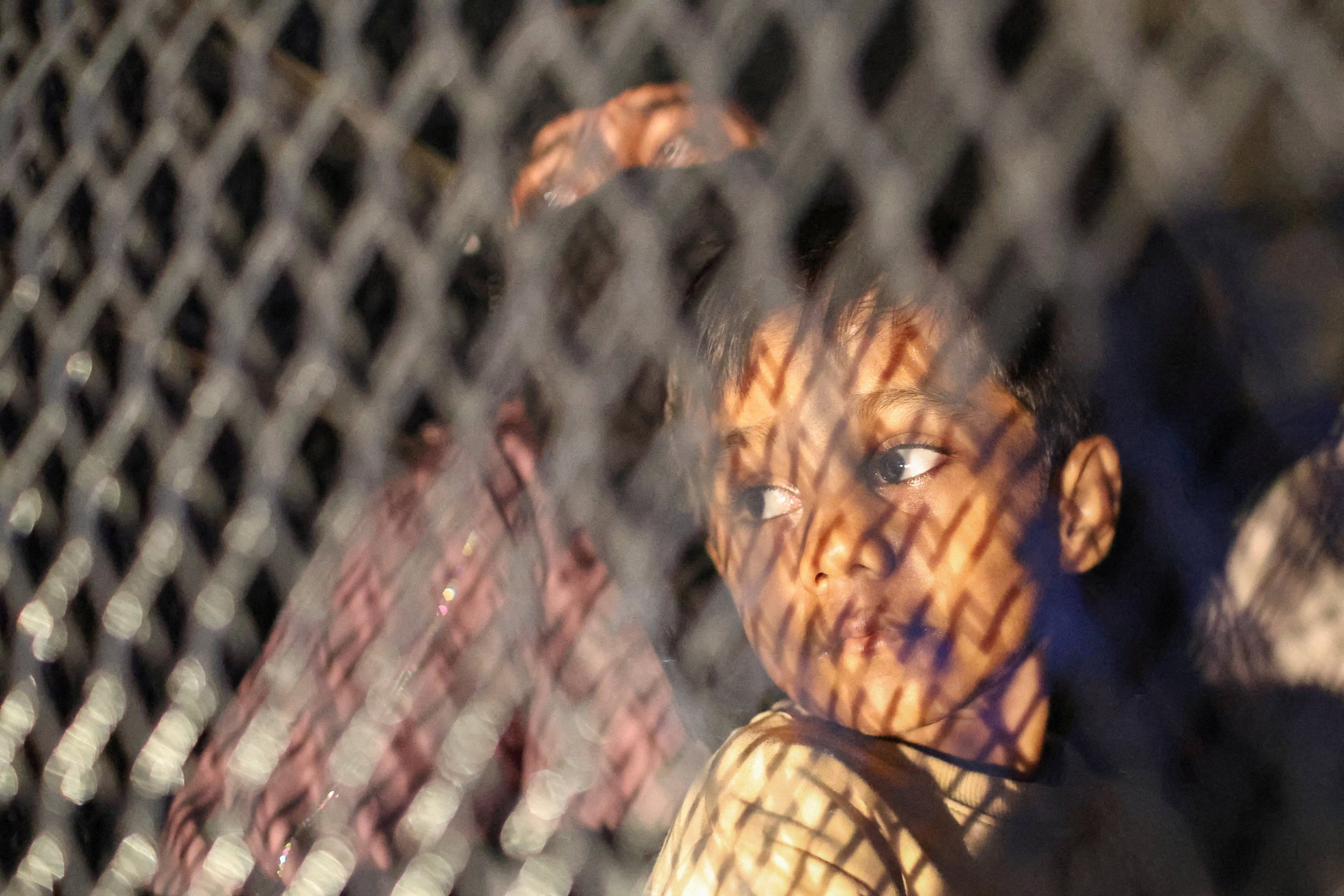 Rohingya refugees sit inside a truck as they are taken by police, in front of the office of the UN Refugee Agency, after being evicted from their homes, in Kuala Lumpur, Malaysia on Monday. Photo: Reuters