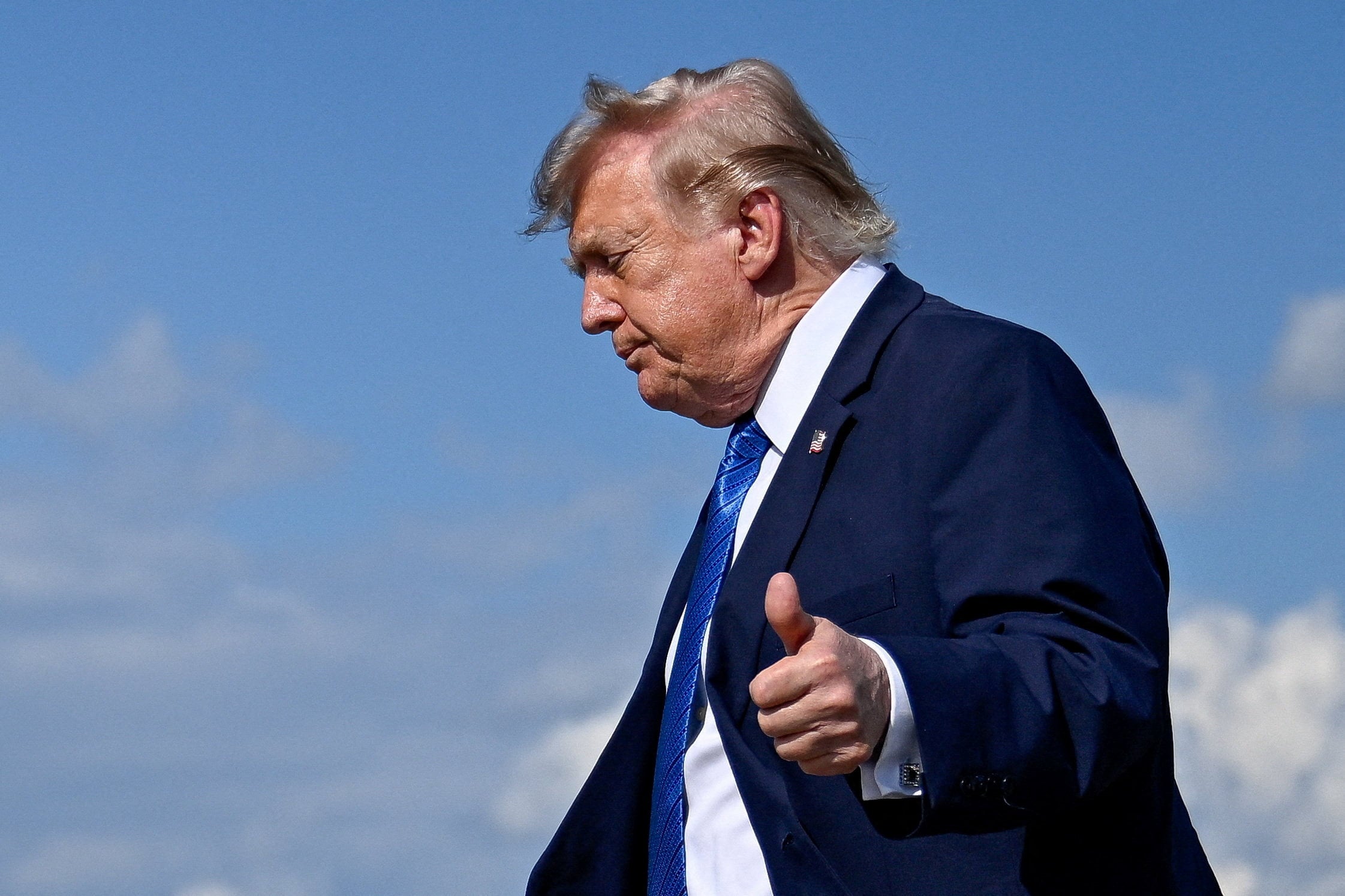 US President Donald Trump gives thumbs-up as he walks to board Marine One following his arrival at Morristown Municipal Airport on Friday. Photo: Reuters