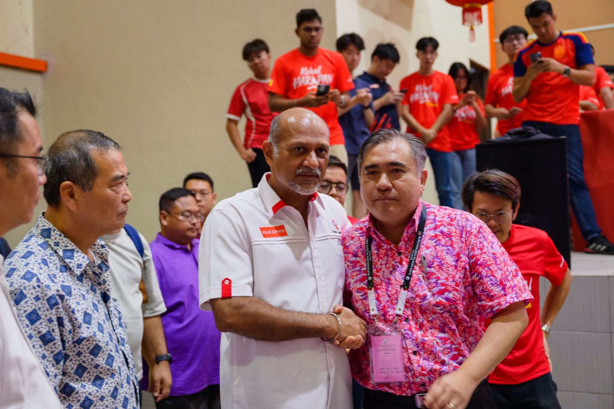 DAP chairman Gobind Singh Deo (left) consoles Anthony Loke after he loses his Chennah seat on Saturday. Photo: Facebook/DAPMalaysia