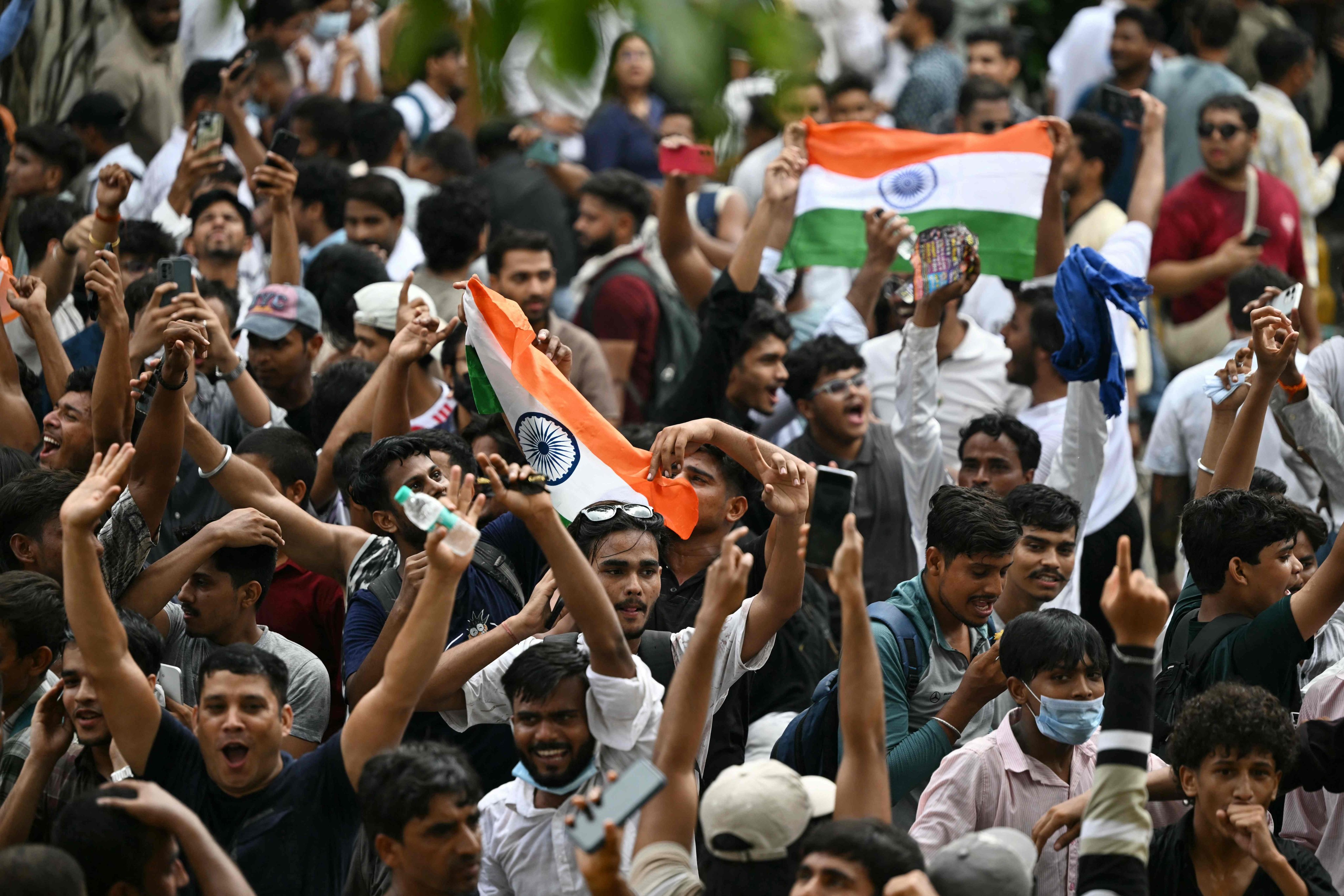 CJP supporters celebrate the resignation of India’s education minister Dharmendra Pradhan on July 25. Photo: AFP
