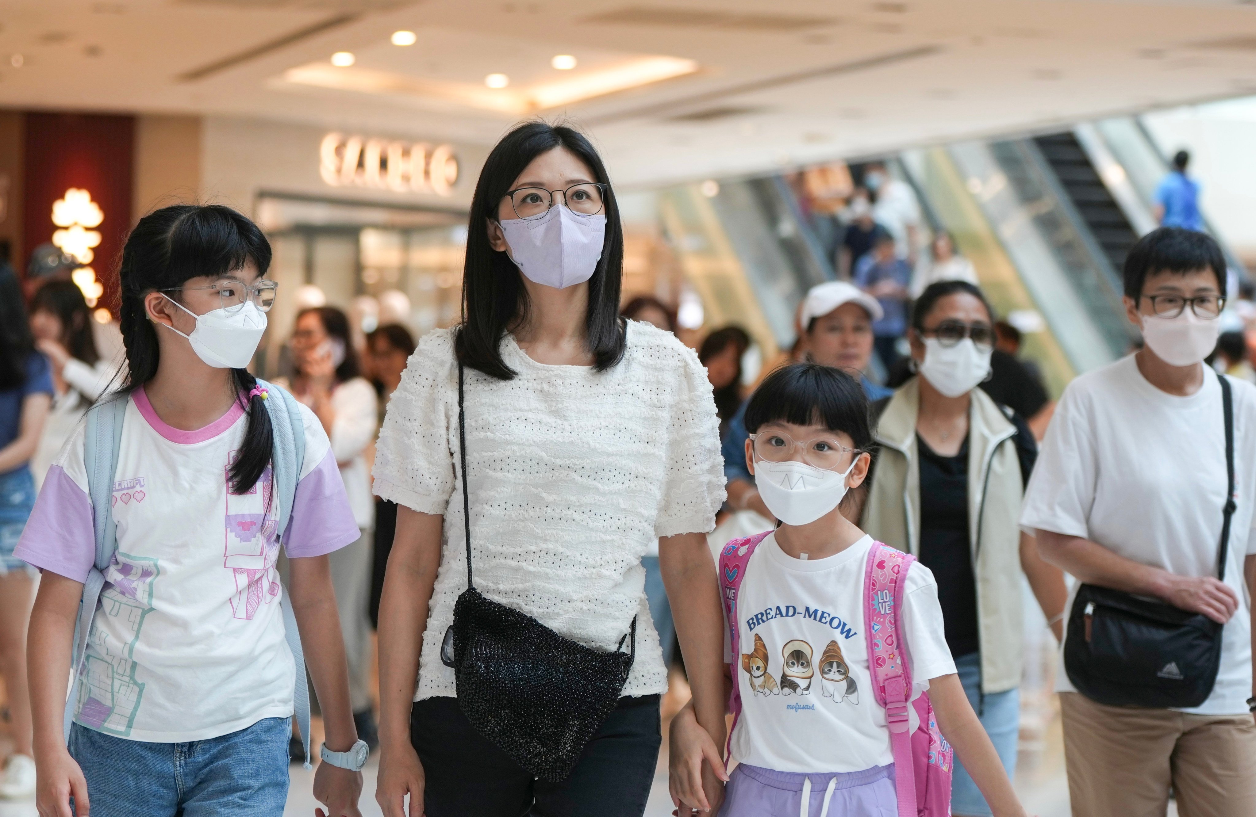 Crowds at New Town Plaza in Shatin. The CHP says high-risk individuals should wear surgical masks when using public transport or staying in crowded places. Photo: Sam Tsang