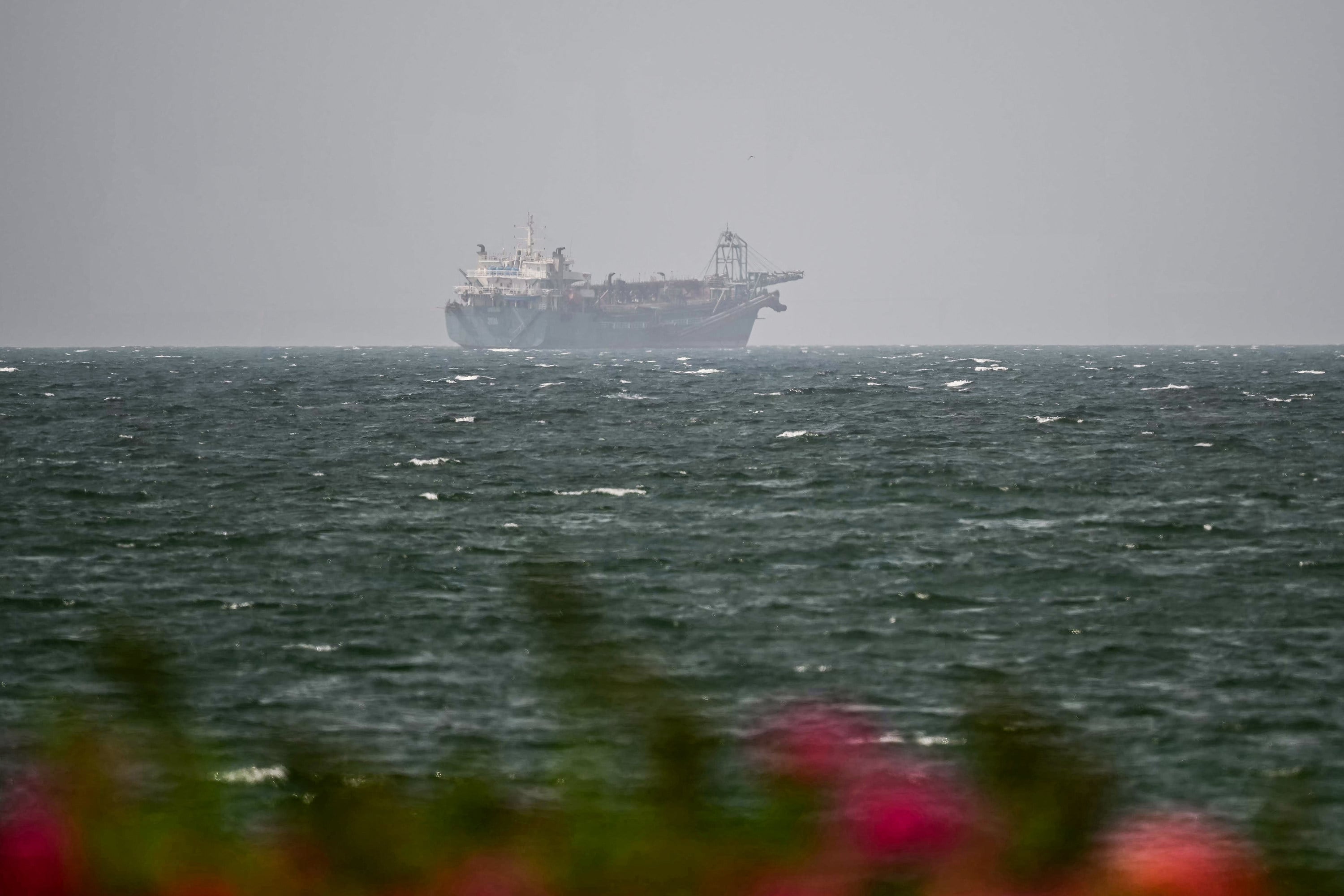 A vessel is seen off the coast of Sharjah in the United Arab Emirates on Monday. Photo: AFP