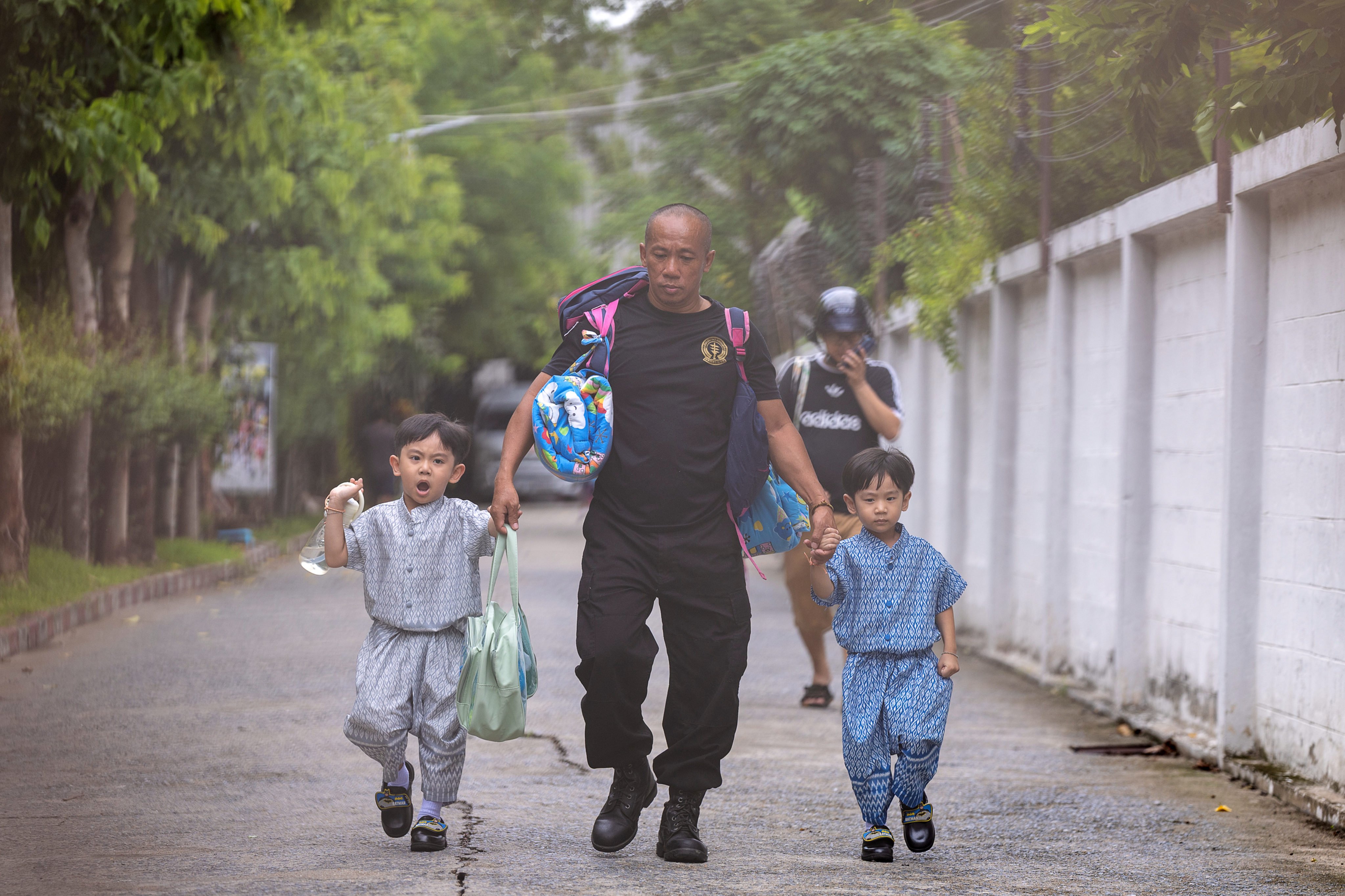 Children are evacuated from around the Debsirin Nonthaburi School on Friday. Photo: AP