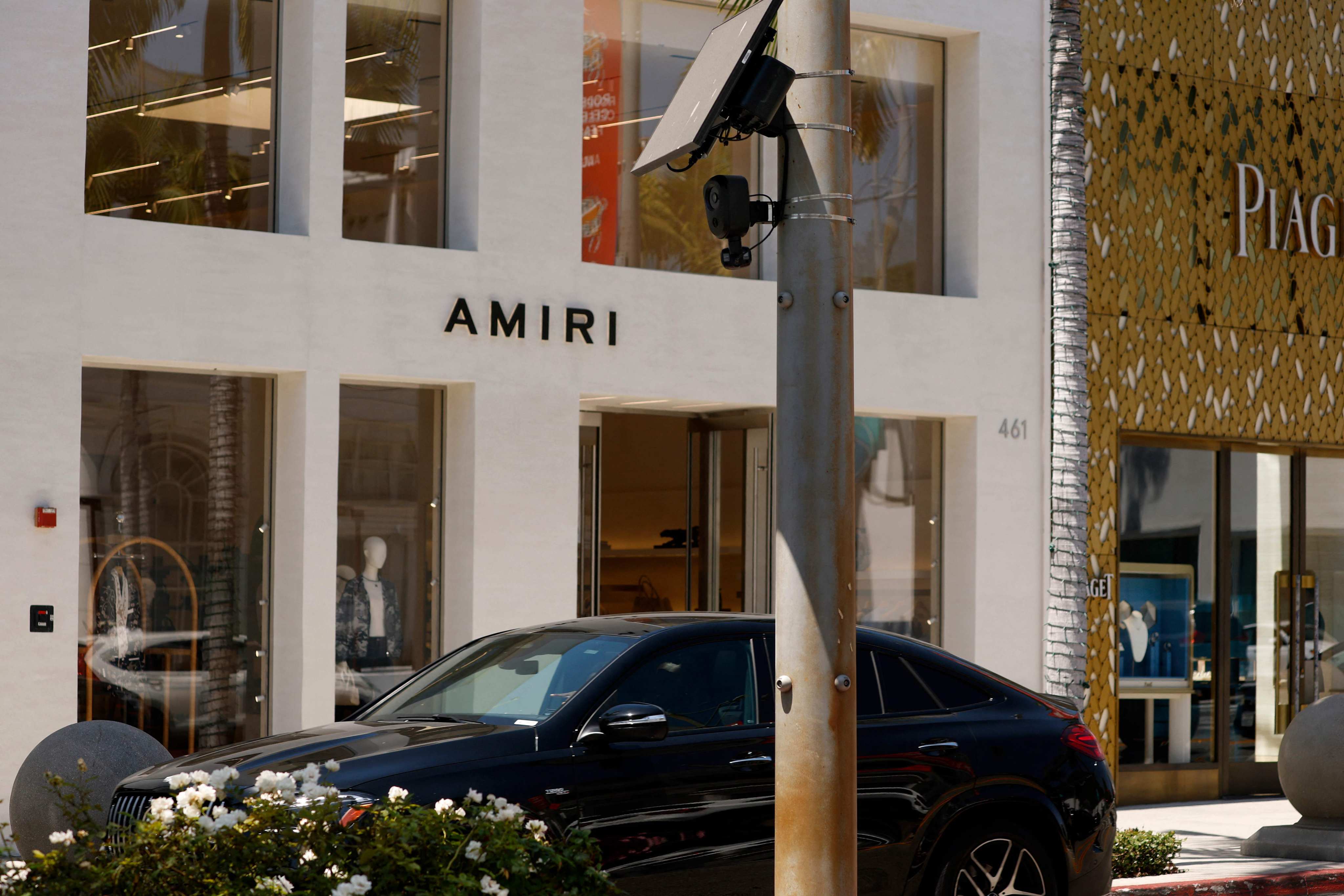 A car drives by a Flock Safety camera mounted to a light pole in Beverly Hills, California. Photo: Getty Images via AFP