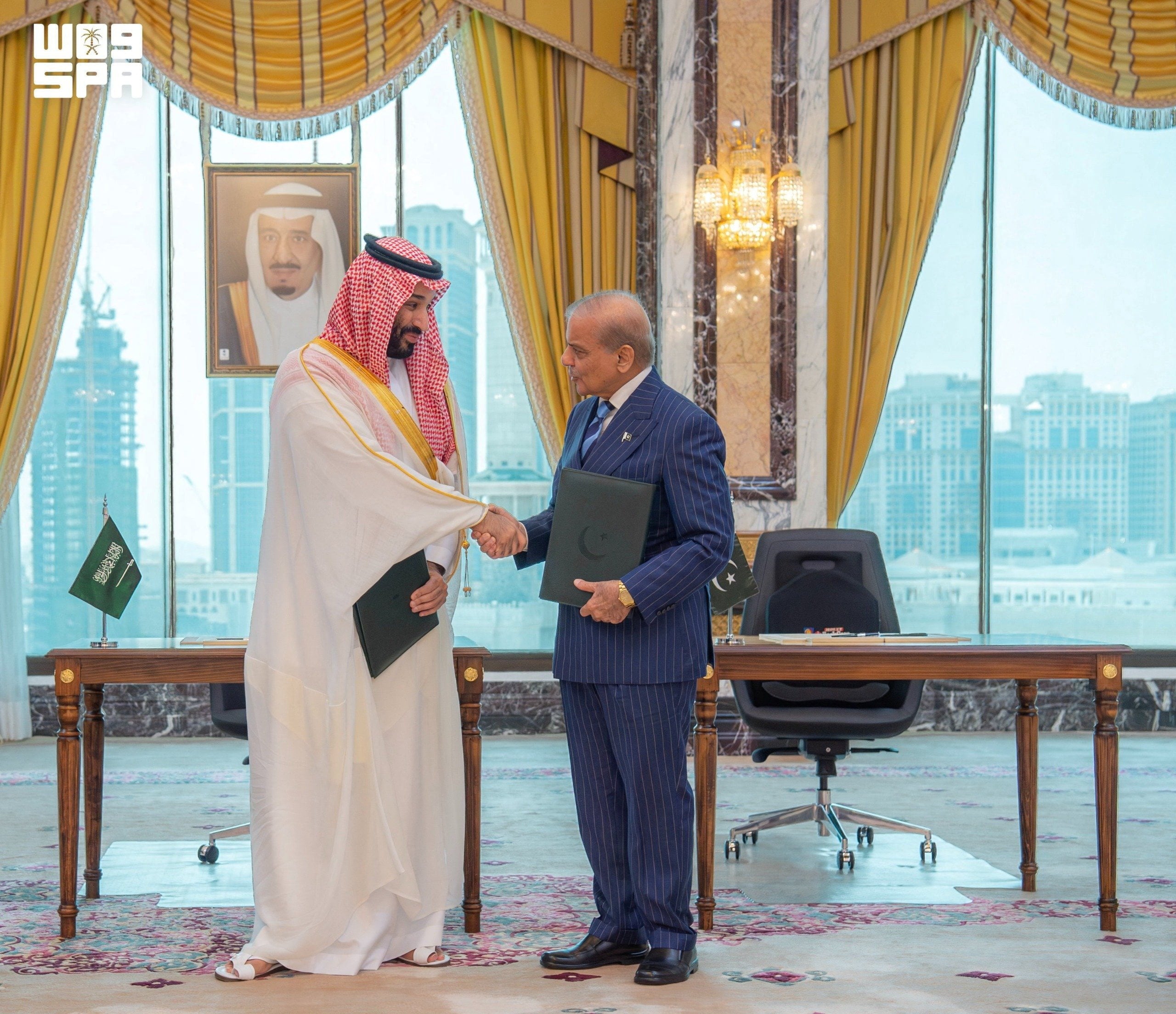 Saudi Crown Prince Mohammed bin Salman shakes hands with Pakistan’s Prime Minister Shehbaz Sharif after signing a joint defence agreement in Mecca on Friday. Photo: Handout/Reuters