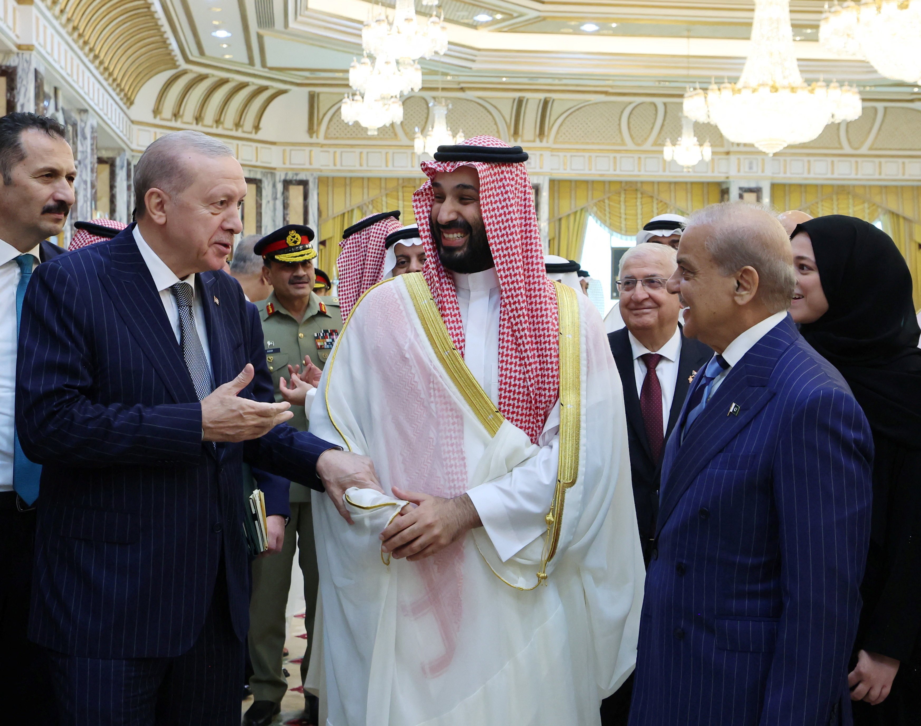 Turkish President Tayyip Erdogan, Saudi Crown Prince Mohammed bin Salman and Pakistan’s Prime Minister Shehbaz Sharif chat after signing a joint defence agreement in Mecca, Saudi Arabia, on Friday. Photo: Turkish Presidential Press Office/Handout via Reuters