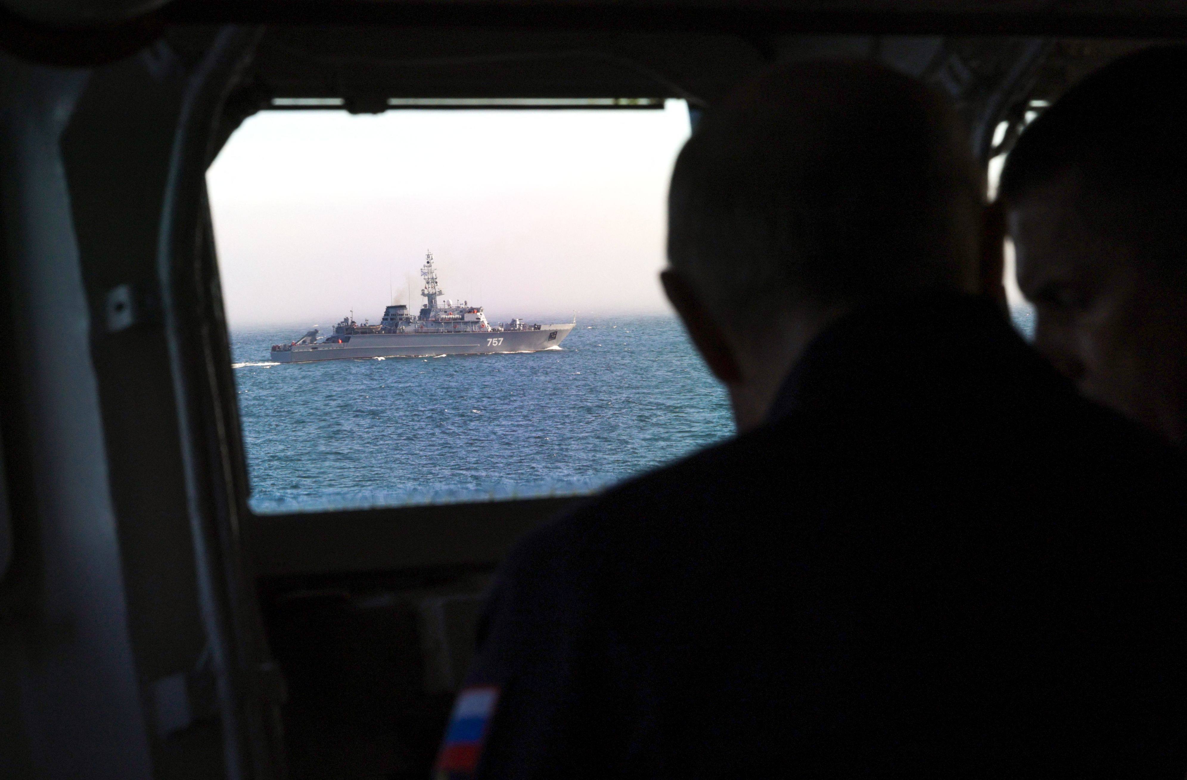 Russia’s President Putin oversees the final stage of the Pacific Fleet’s naval drills from on board the Russian Navy’s guided missile cruiser Varyag off the far eastern Sakhalin Island on Wednesday. Photo: AFP