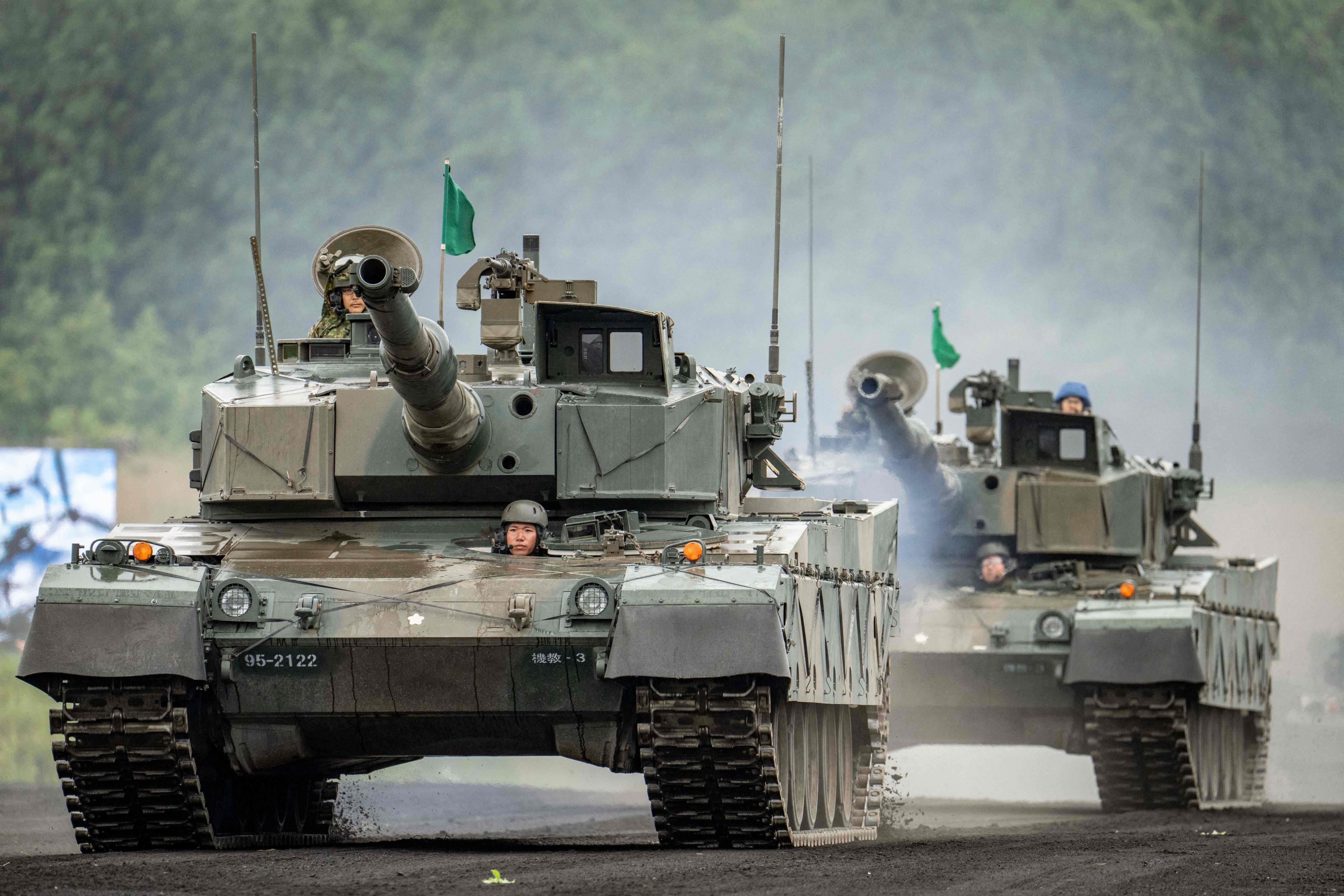 Type 90 battle tanks of the Japan Ground Self-Defence Force are seen during a live fire exercise in Gotemba on June 7. Photo: AFP