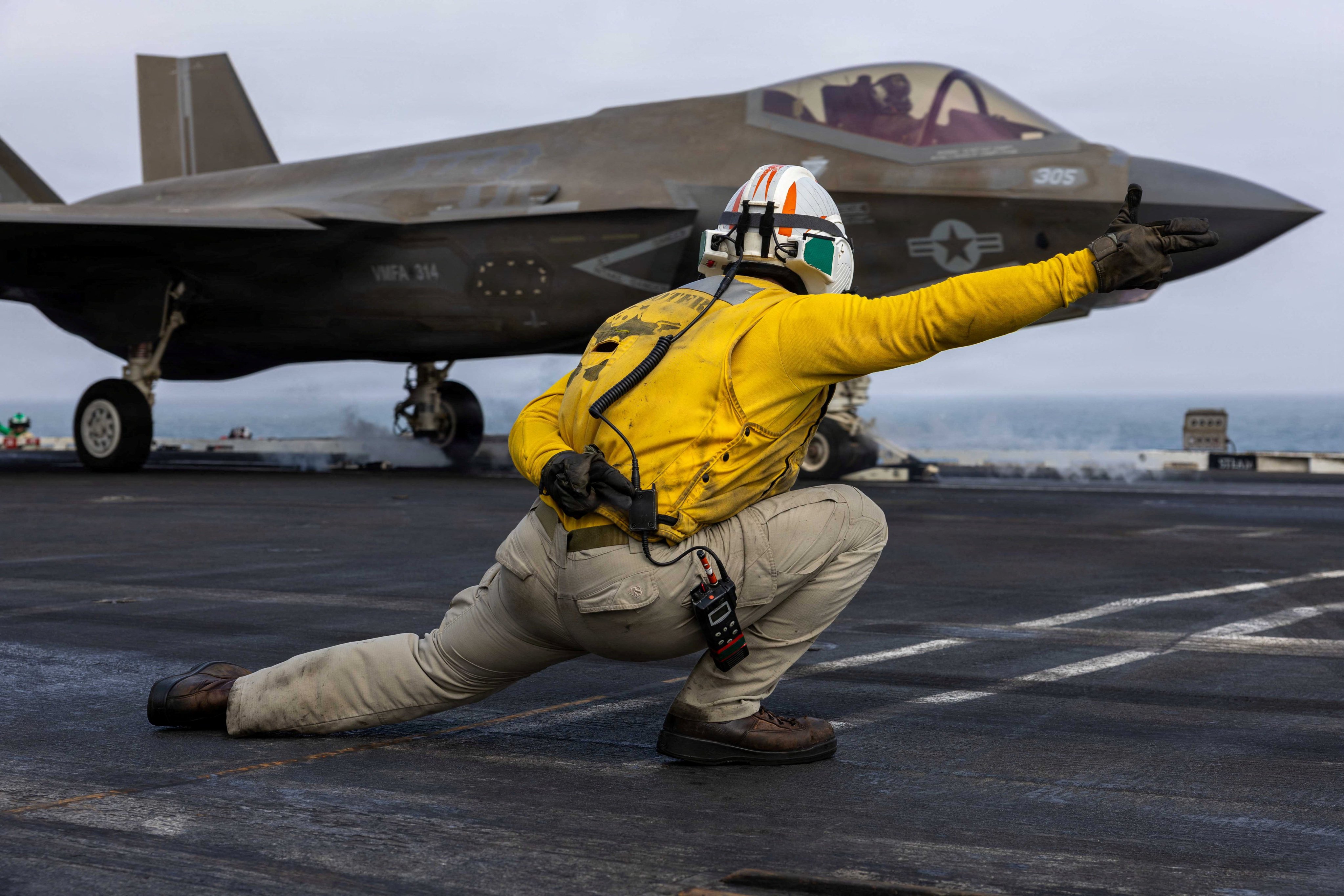 A US sailor launches an F-35C Lightning II from the USS Abraham Lincoln’s flight deck. Photo: US Navy/Reuters