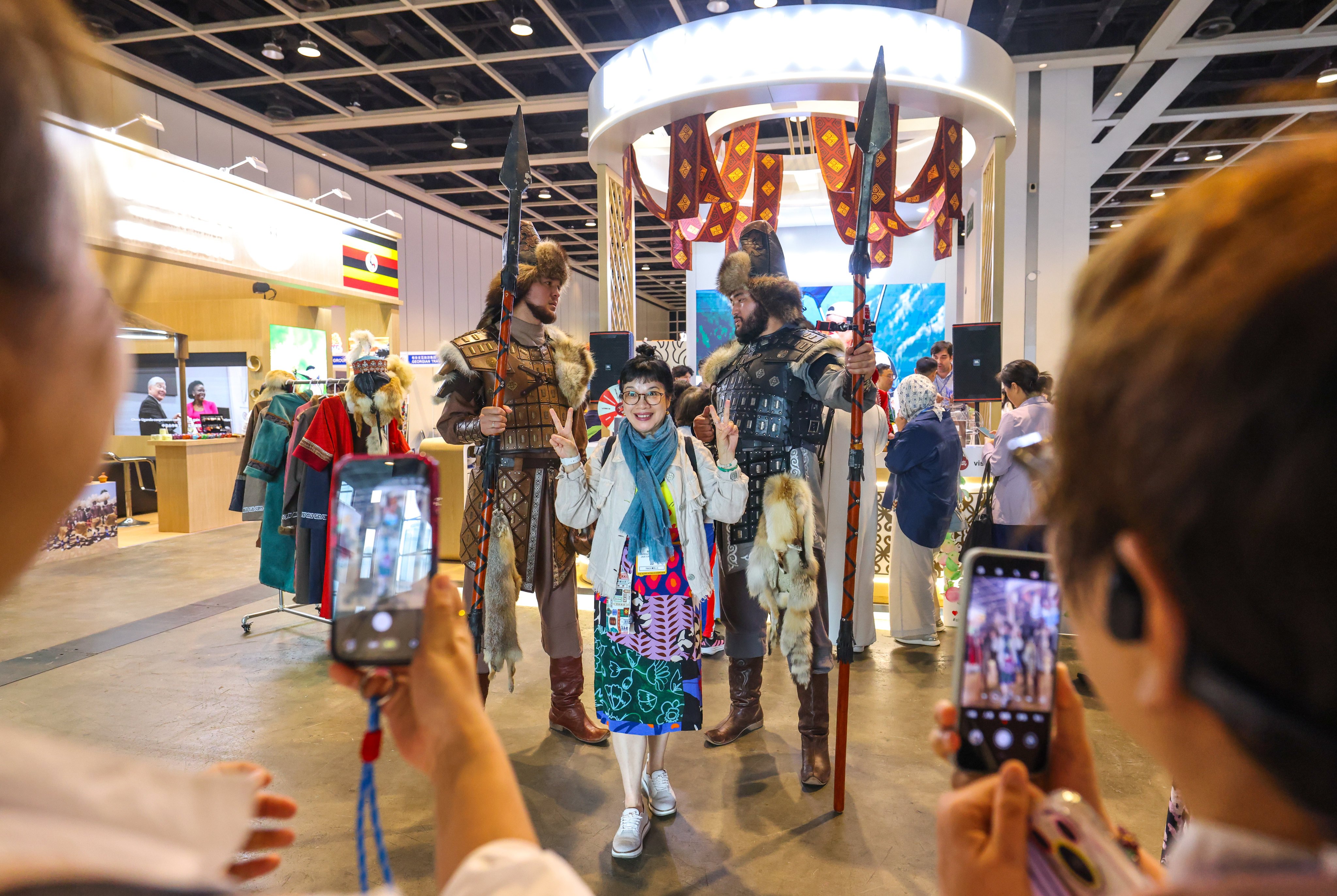 Visitors take photos at Kazakhstan’s booth for the 2026 International Travel Expo in Hong Kong. The country is part of the Belt and Road Initiative, with mainland businesses eager to expanded into member markets. Photo: Nora Tam