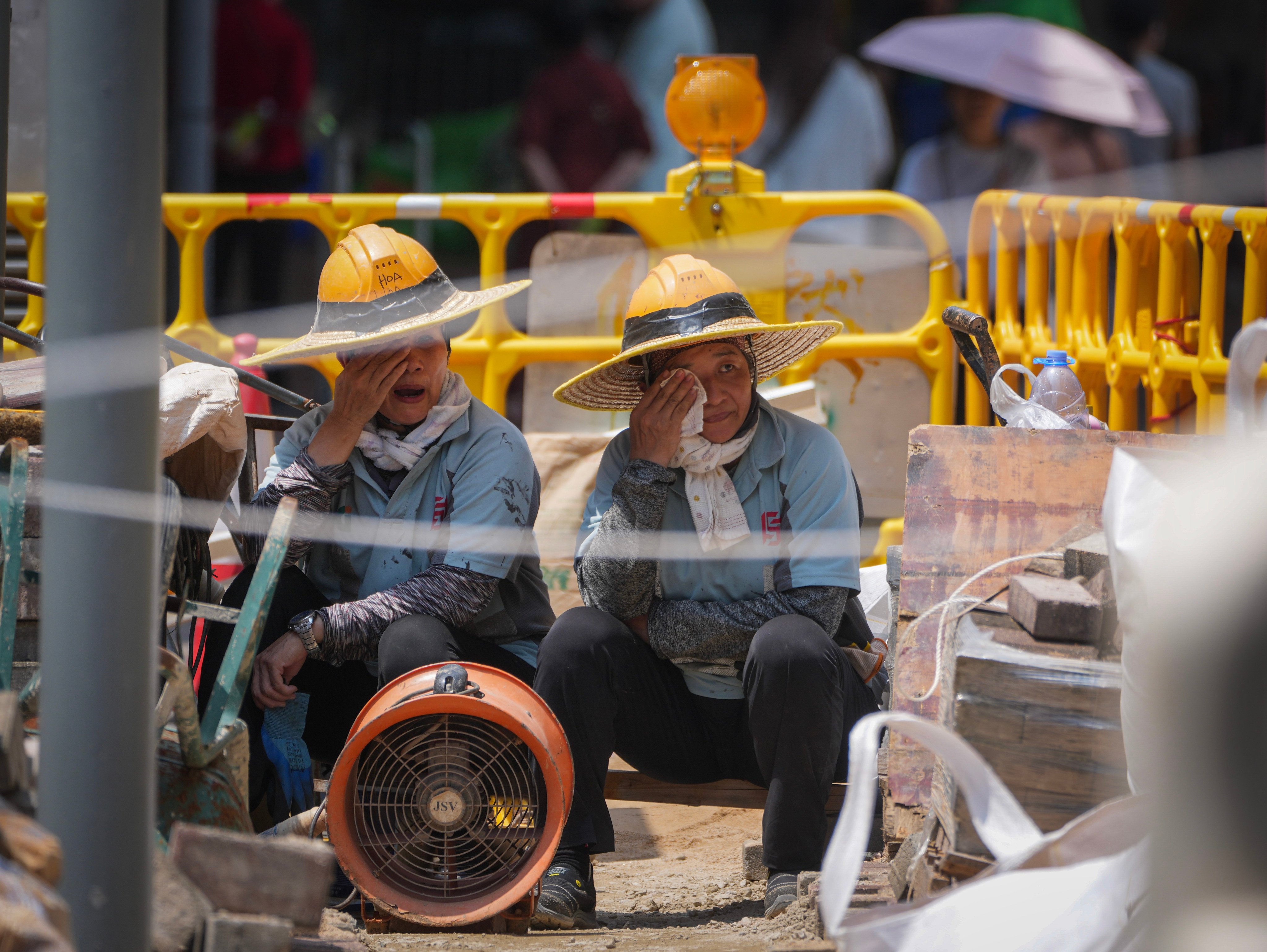 Authorities are reviewing thresholds for Hong Kong’s heat-stress work warnings following criticism over the system’s response to extreme heat. Photo: Sam Tsang