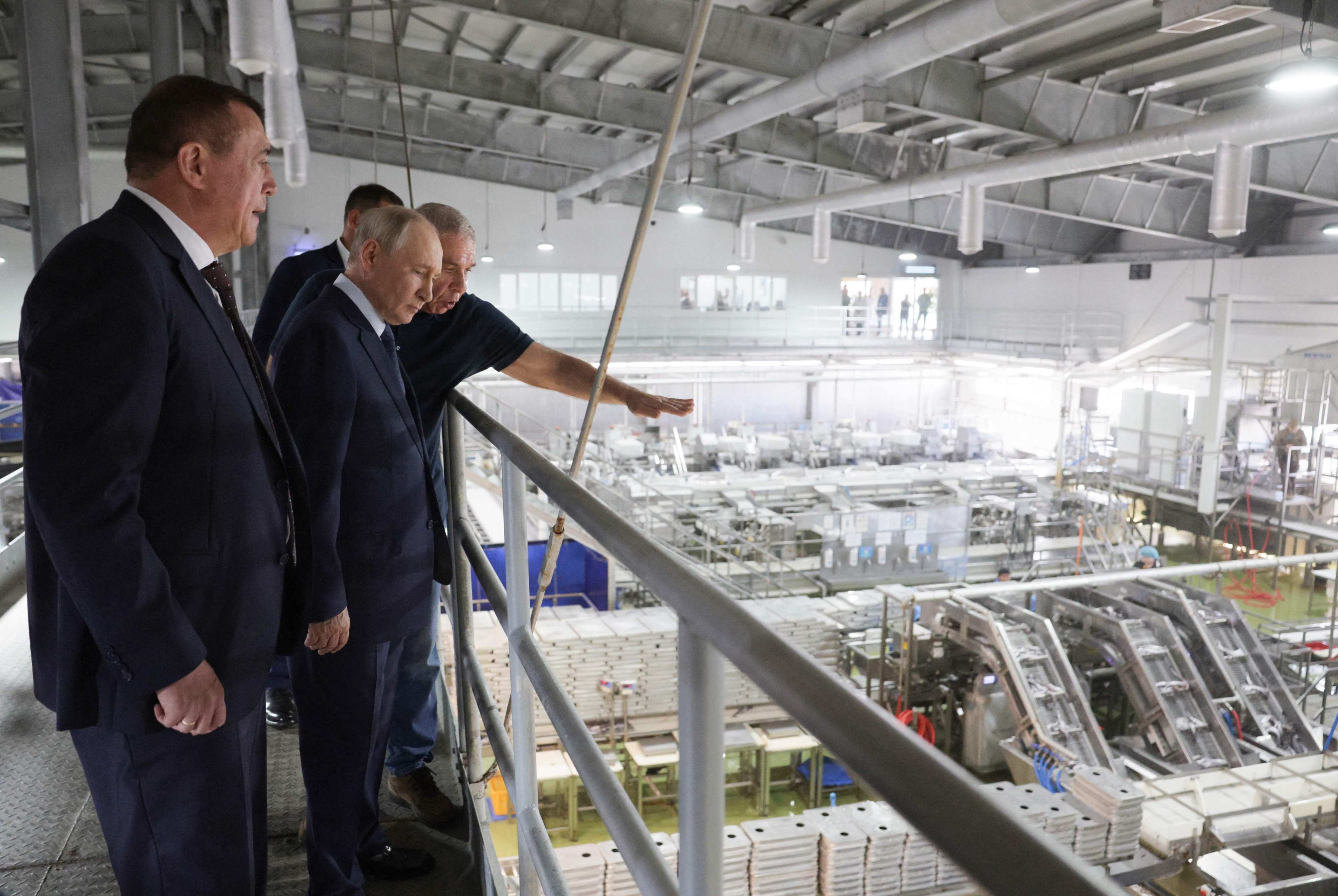 Vladimir Putin visits a fish processing factory on Iturup Island on August 13. Photo: AFP
