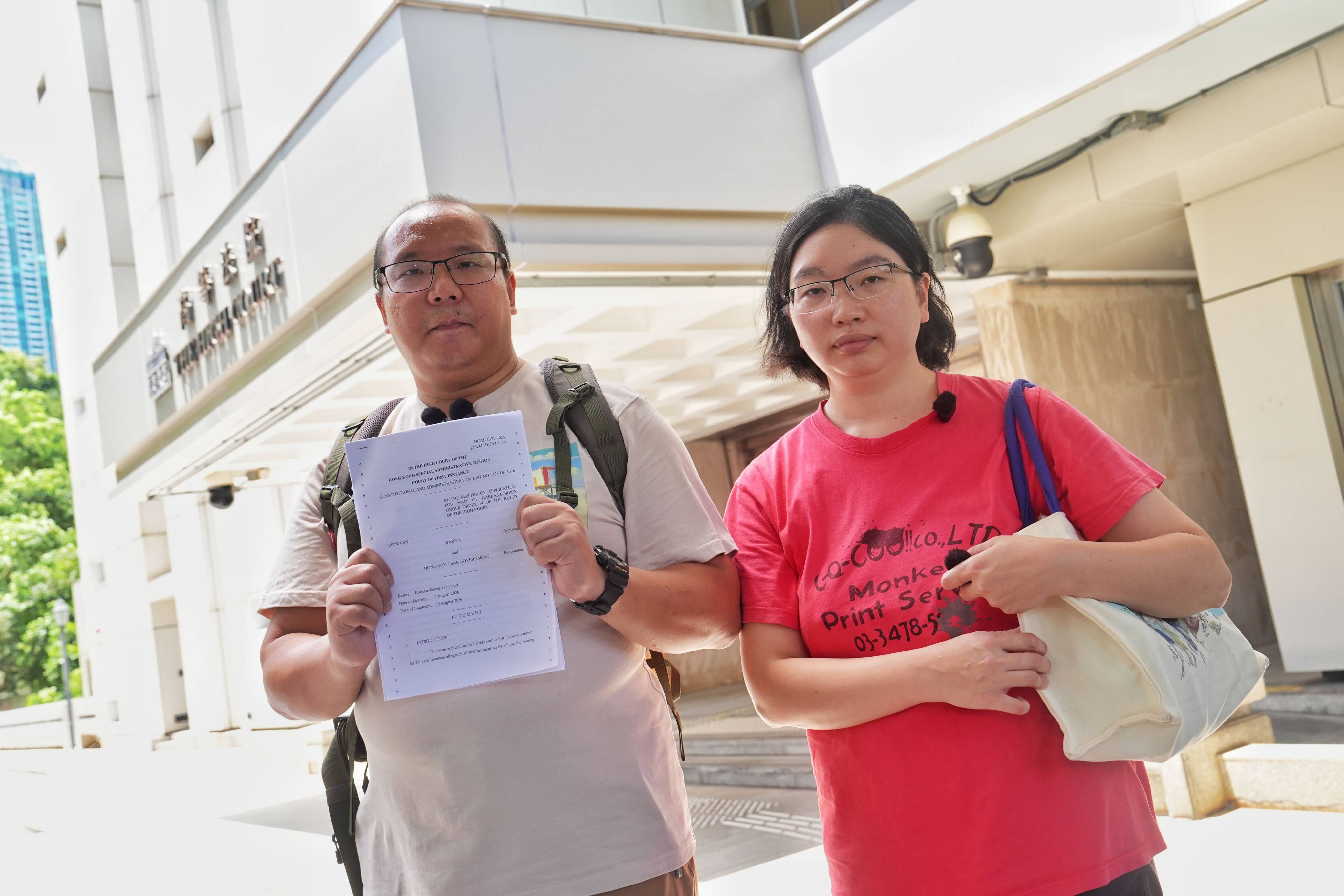 Baby Danny’s parents, Tsang Wai-bong (left) and Kwan Pui-sin, speak with the media after the court hearing on Wednesday. Photo: Elson Li