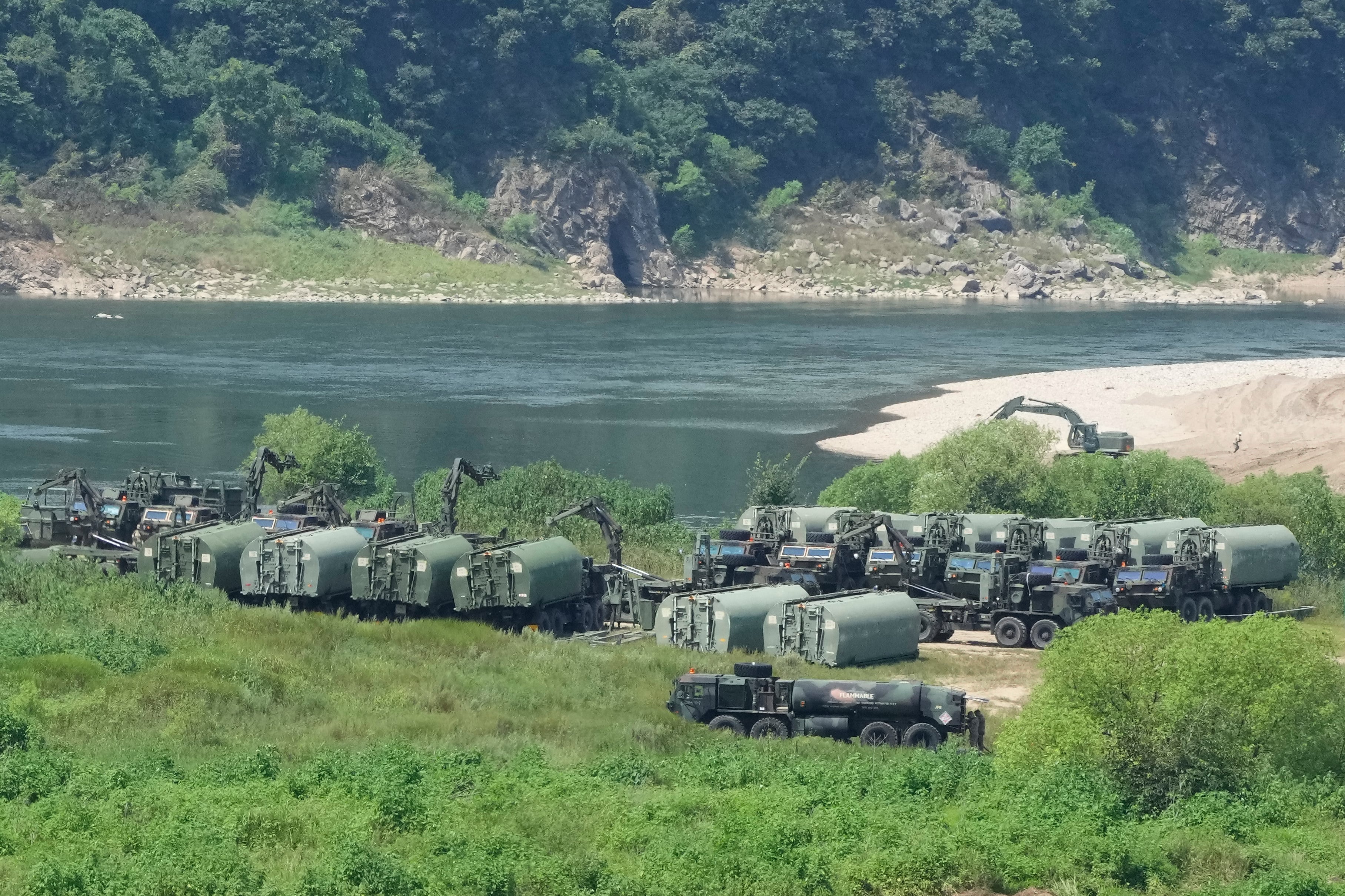 US Army armoured vehicles gather to cross a river at a training field in Yeoncheon, South Korea, on Tuesday. Photo: AP