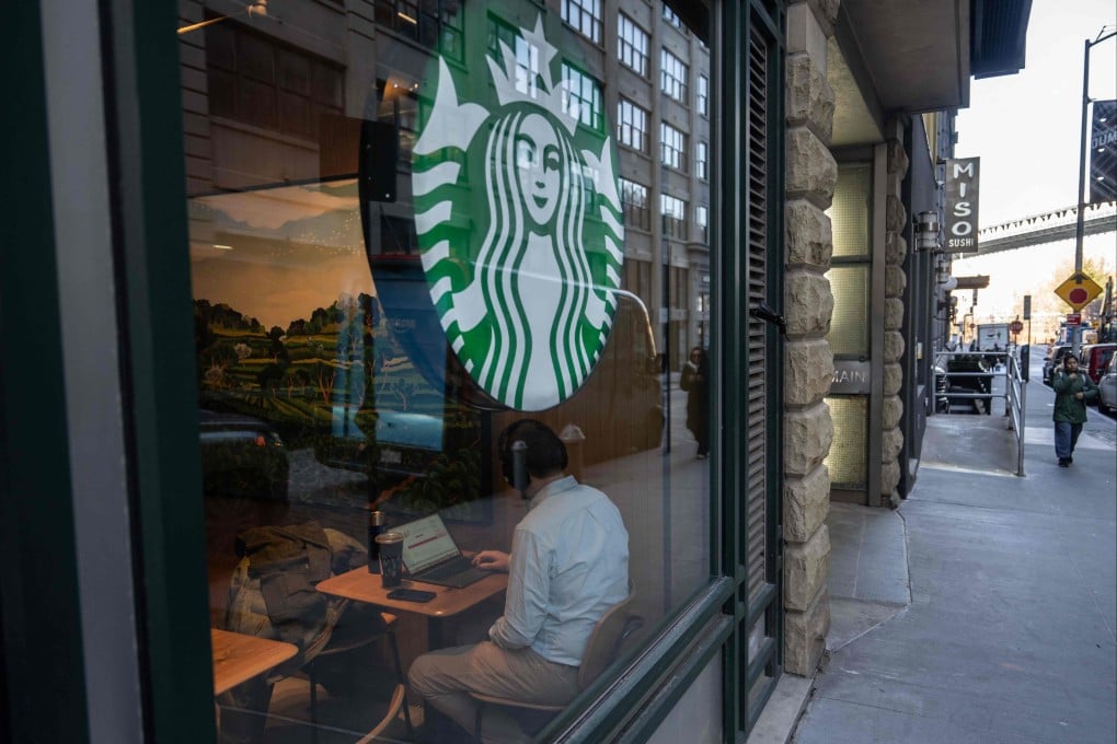 A person uses a laptop inside of a Starbucks in the Brooklyn Borough of New York City. Photo: AFP