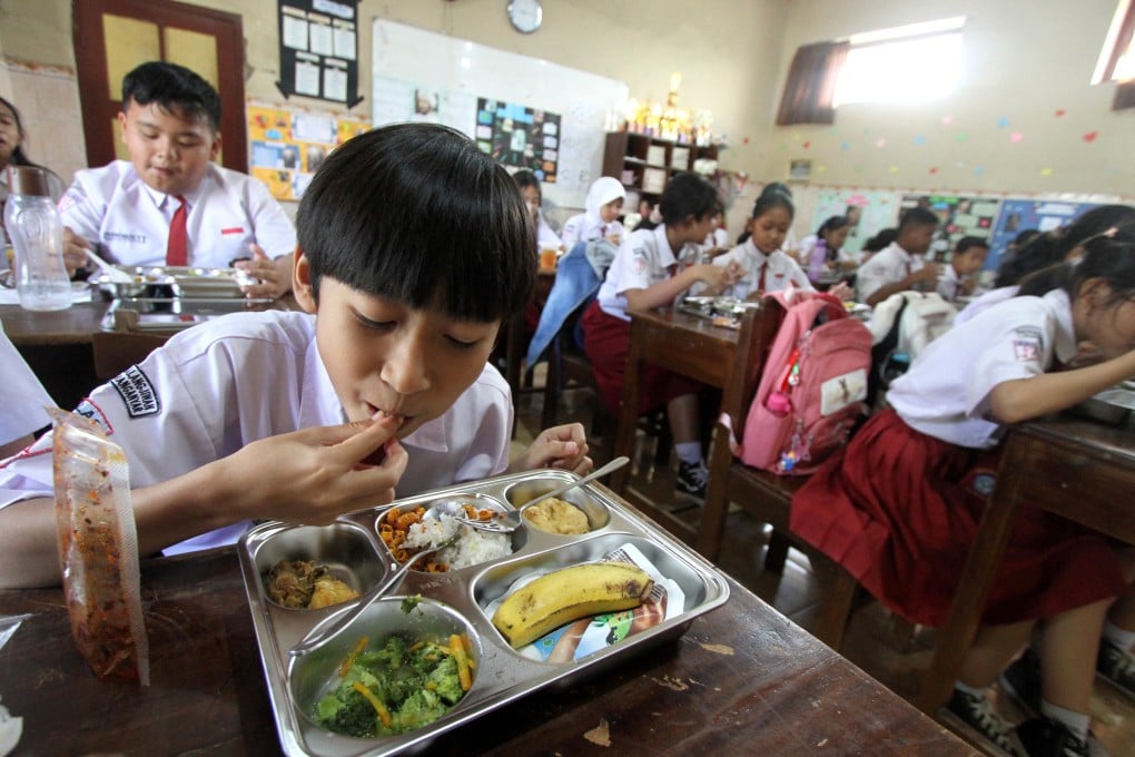 Pupils enjoy their breakfast in Surakarta, Central Java, Indonesia, on January 6 as part of a free-meal scheme. Photo: Xinhua