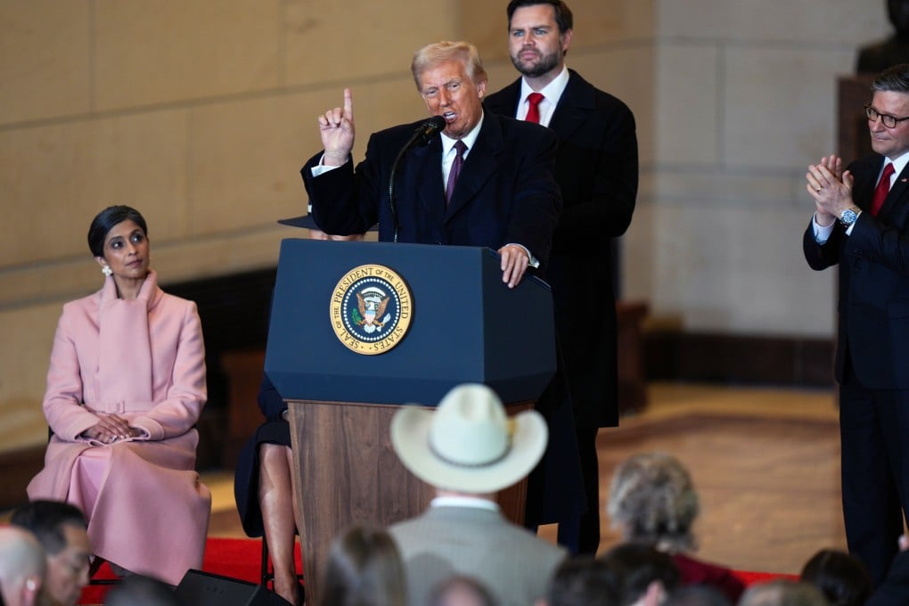 US President Donald Trump speaks to the crowd as Vice-President J.D. Vance looks on in the Emancipation Hall after being sworn in as the 47th president of the United States on Monday in Washington. Photo: Pool / Getty Images / TNS