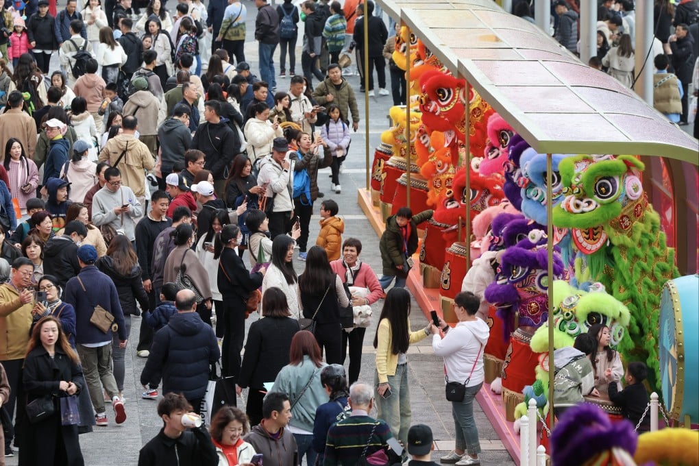 Tourists and locals enjoy the festive decorations in Tsim Sha Tsui. Photo: Dickson Lee